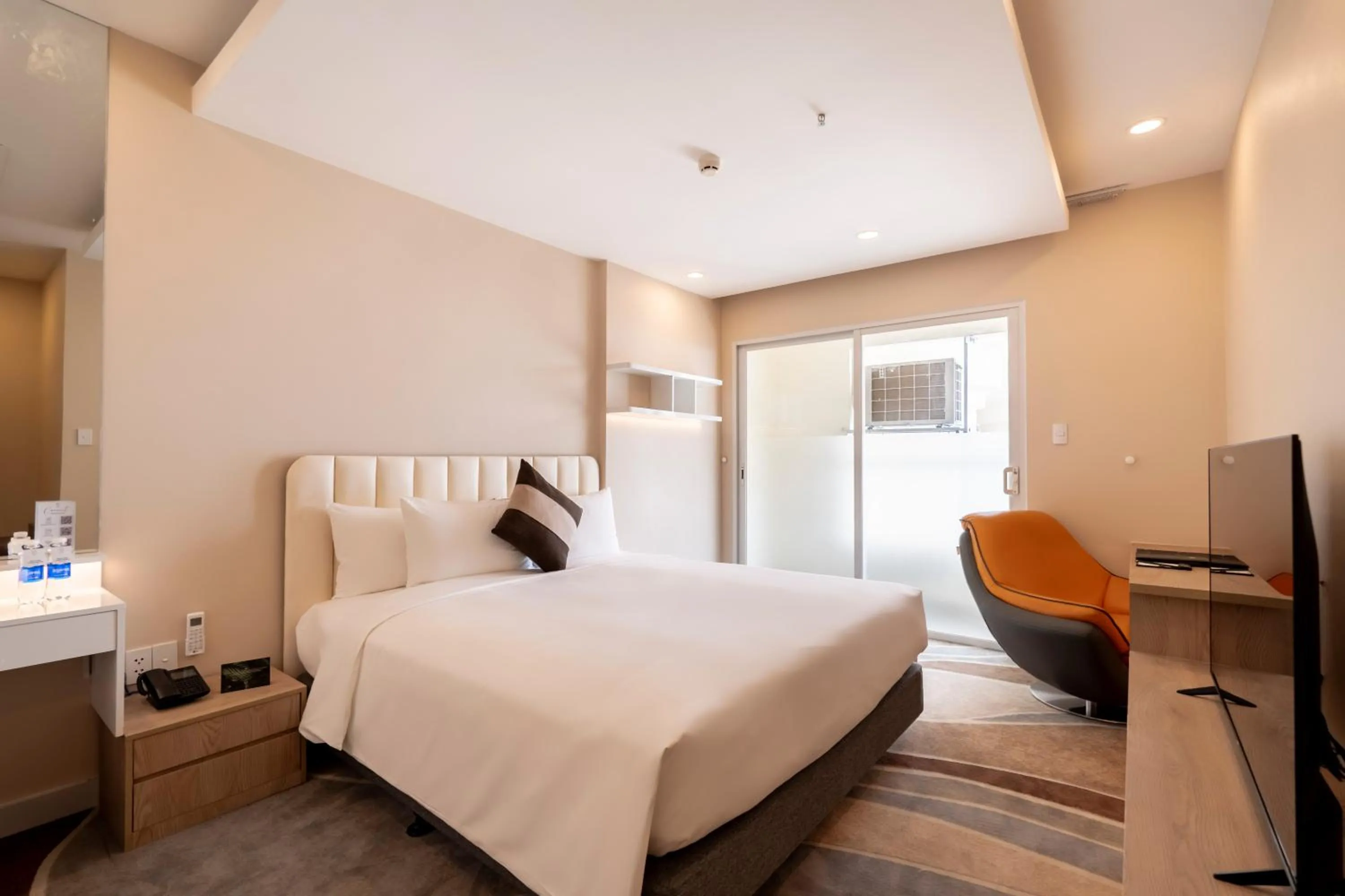 Bed in La Vela Saigon Hotel