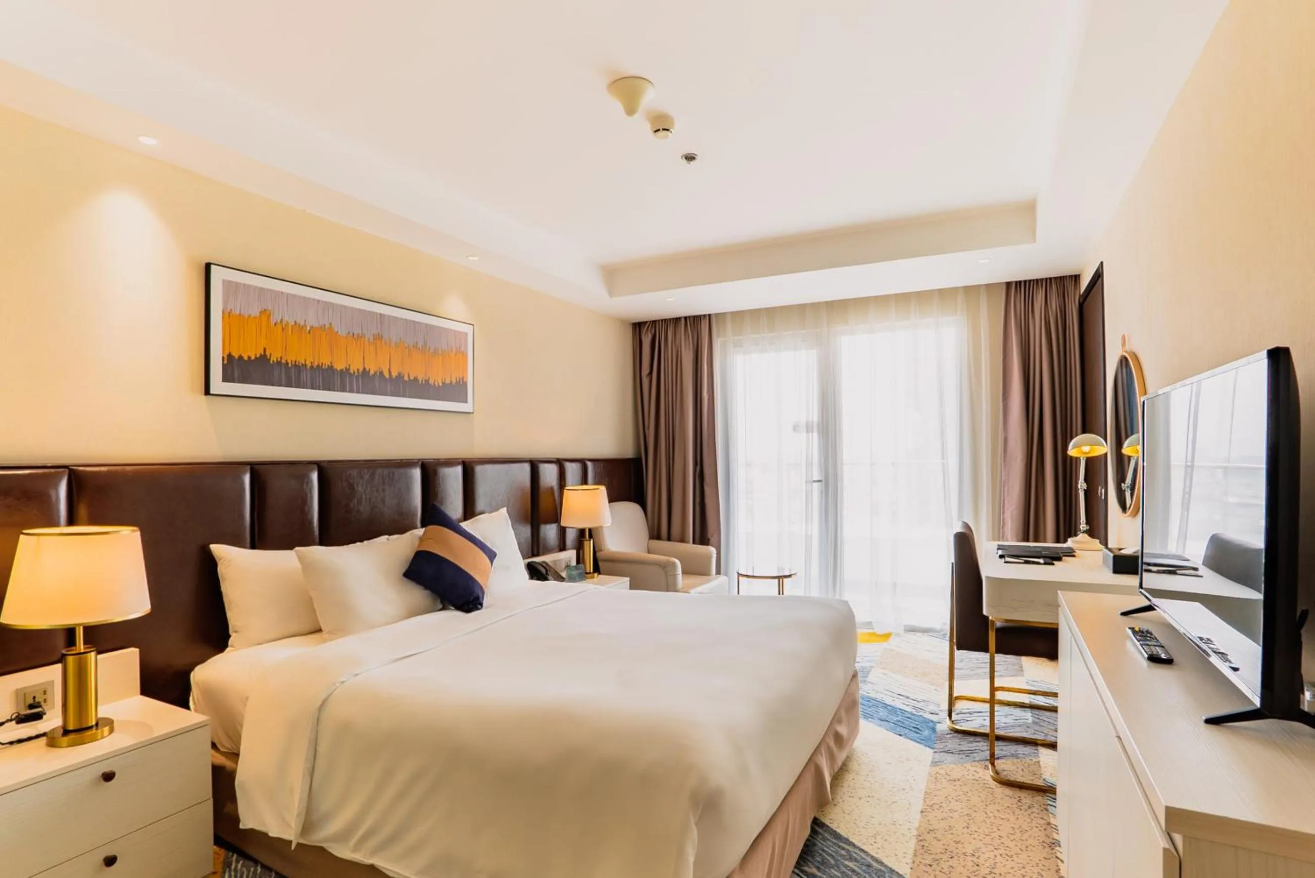 Bed in La Vela Saigon Hotel