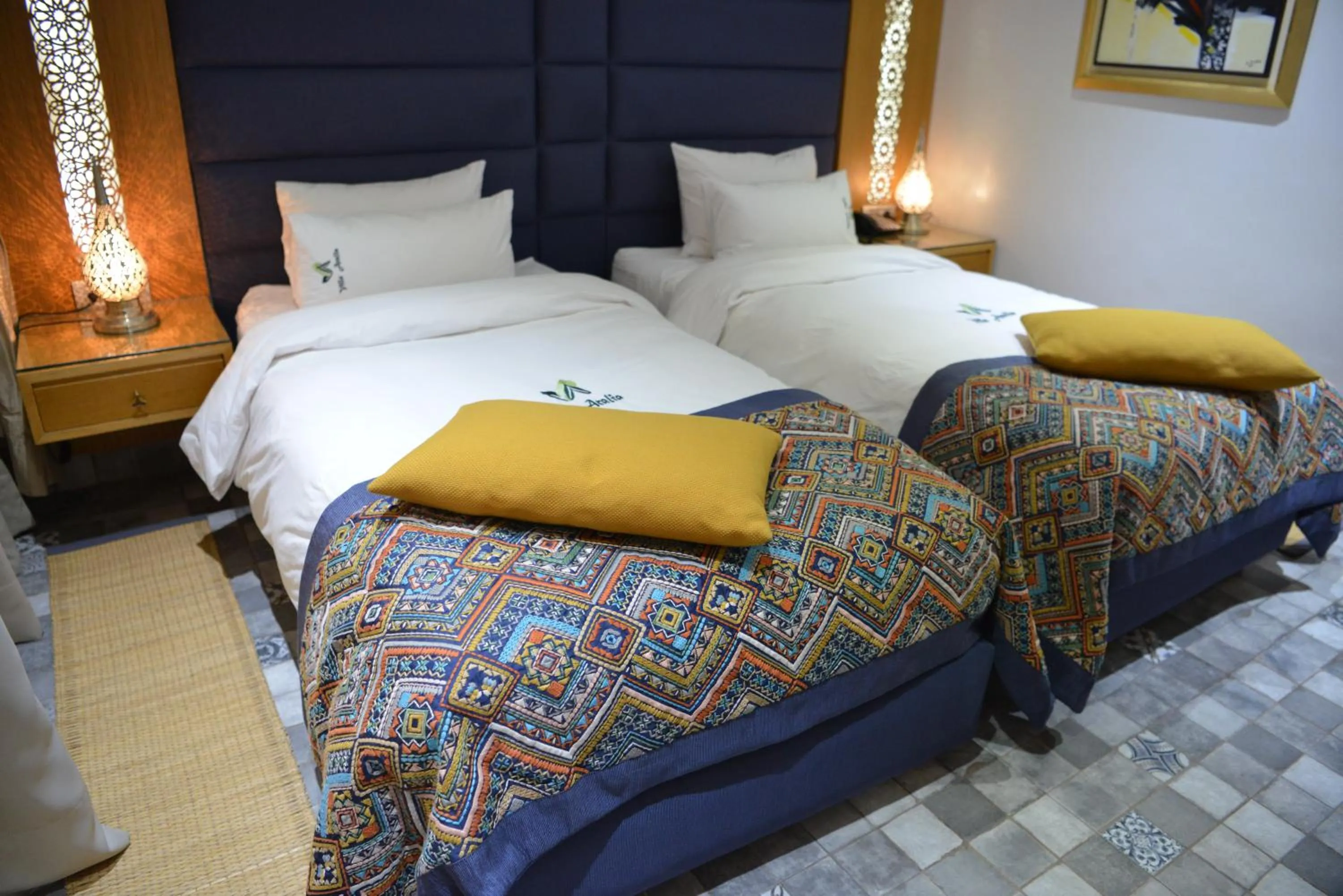 Bed in Aralia Boutique Hôtel