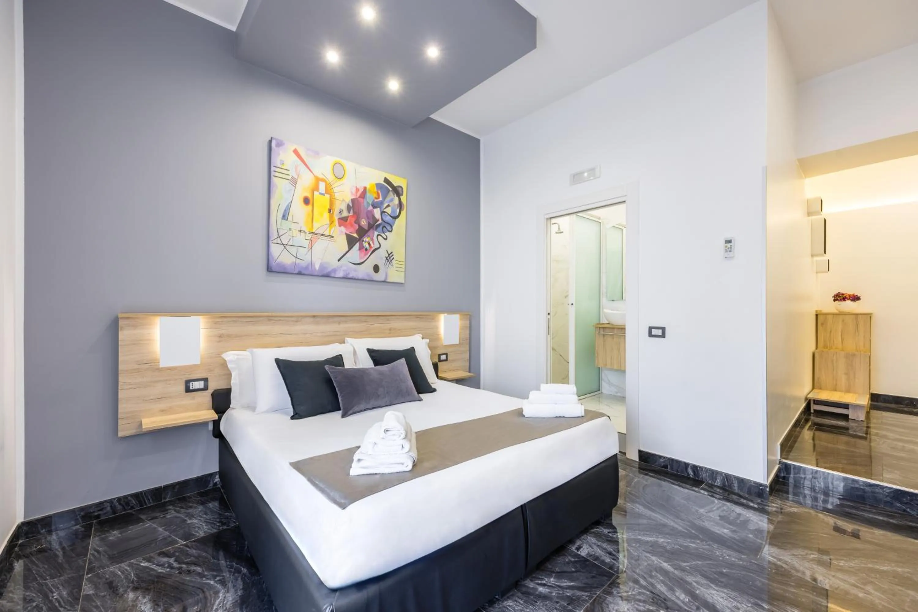 Bed in Bella Napoli Suites