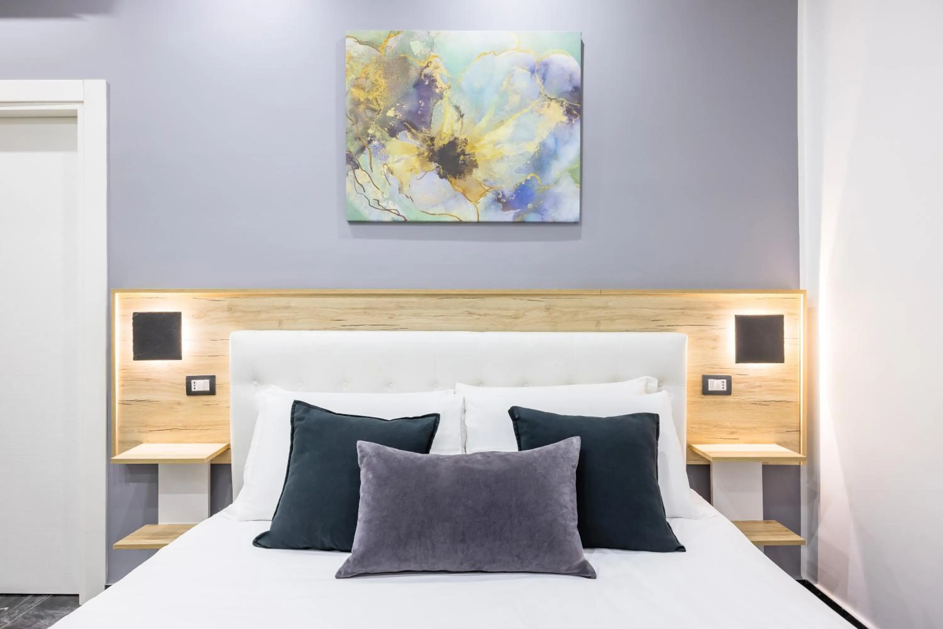 Bed in Bella Napoli Suites