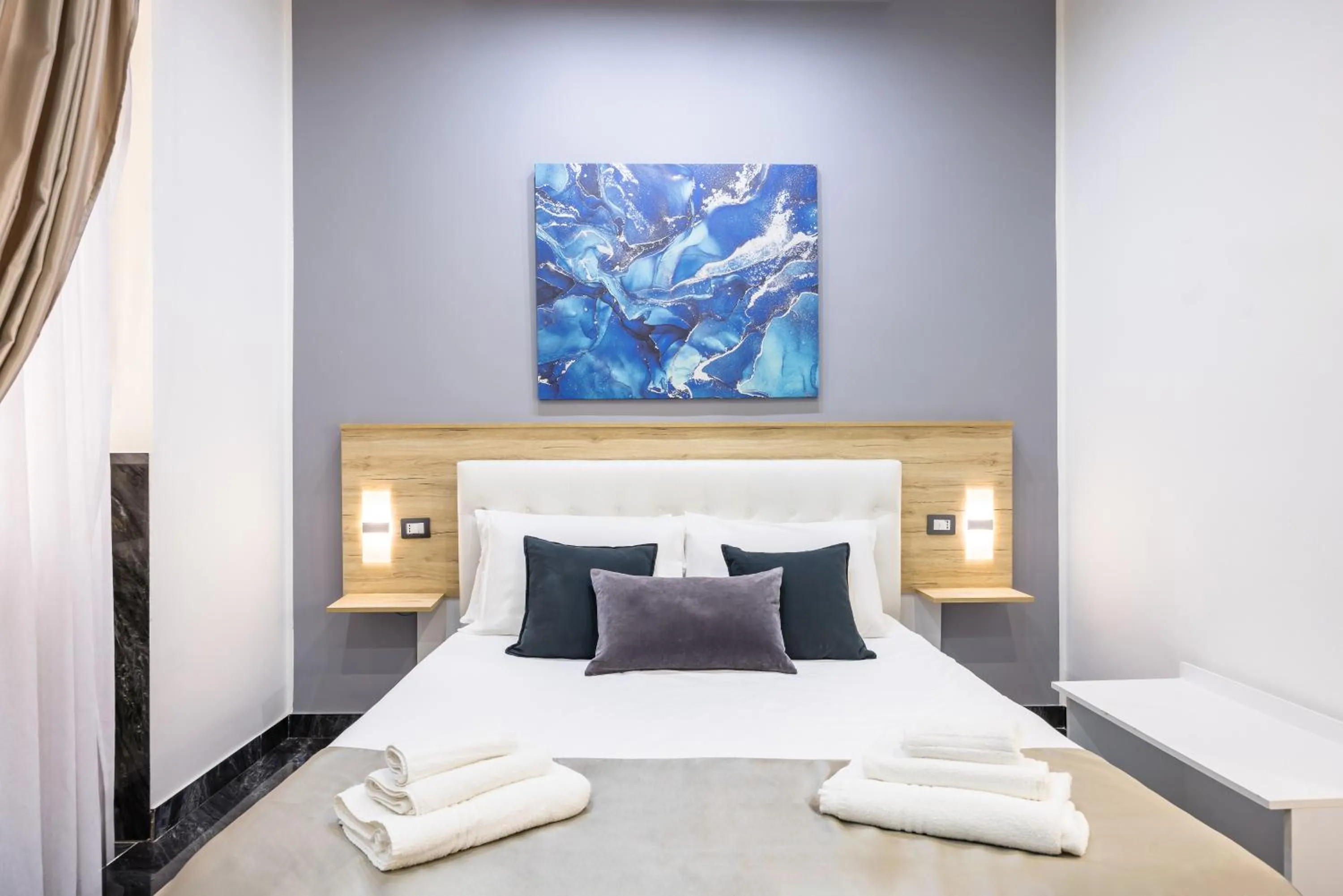 Bed in Bella Napoli Suites