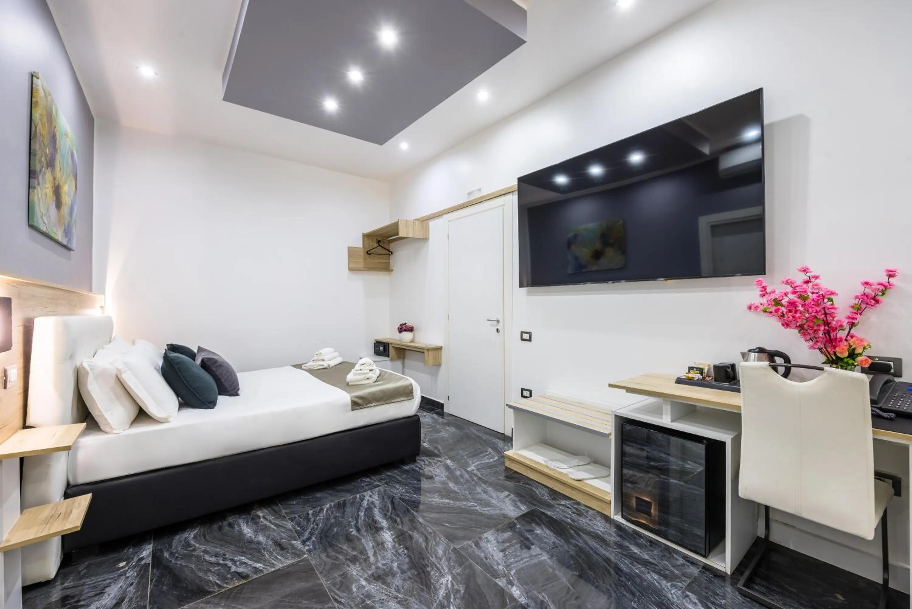 Bed in Bella Napoli Suites