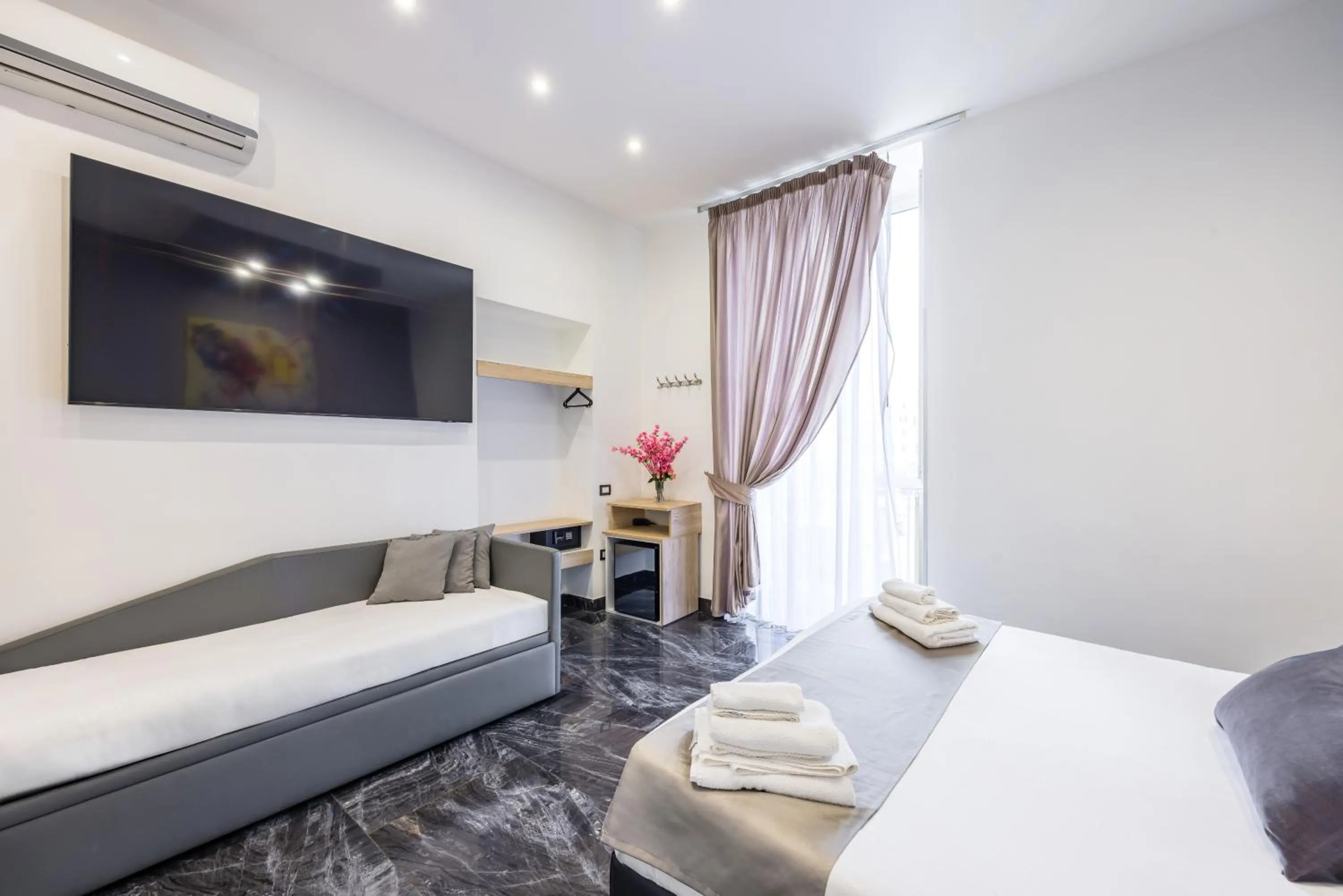 Bed in Bella Napoli Suites