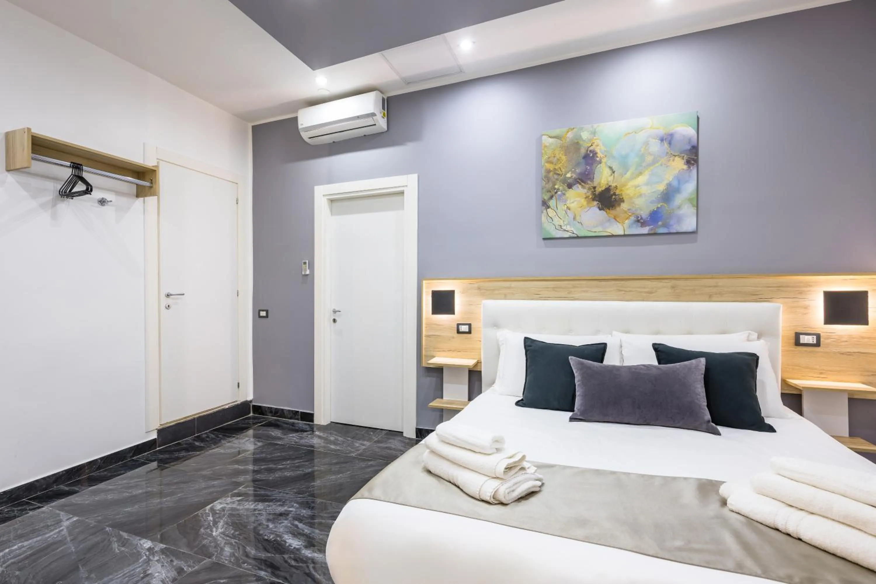 Bed in Bella Napoli Suites