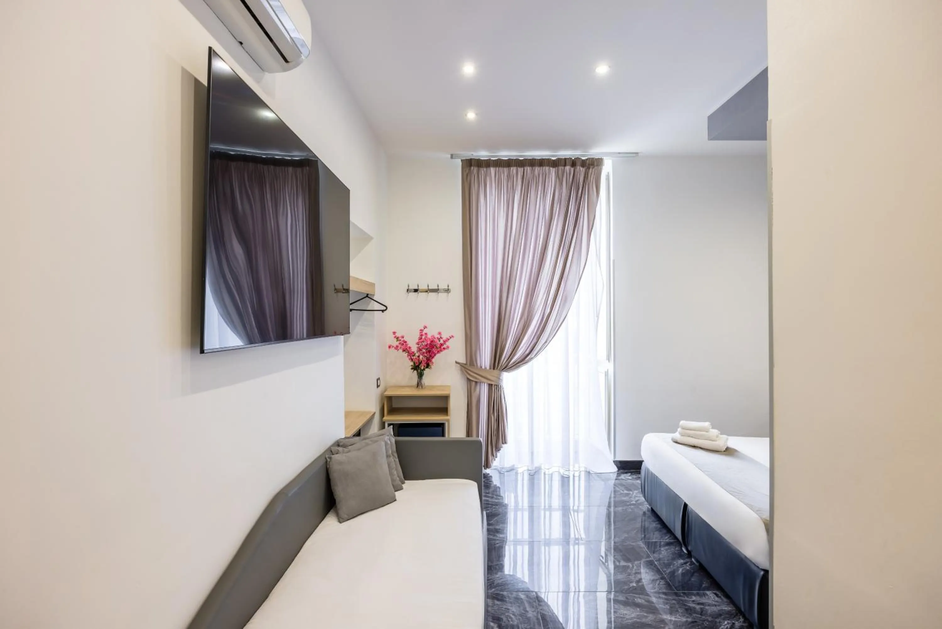 Bed in Bella Napoli Suites