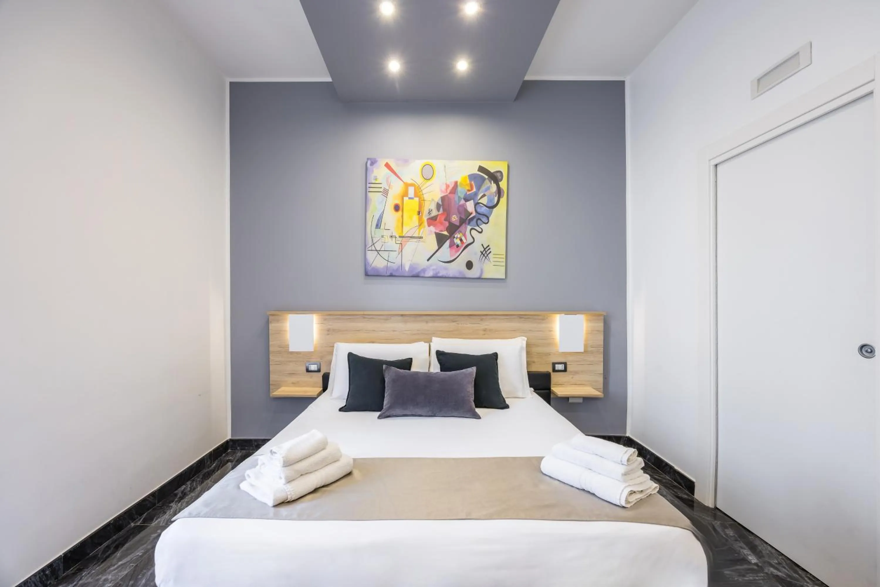 Bed in Bella Napoli Suites