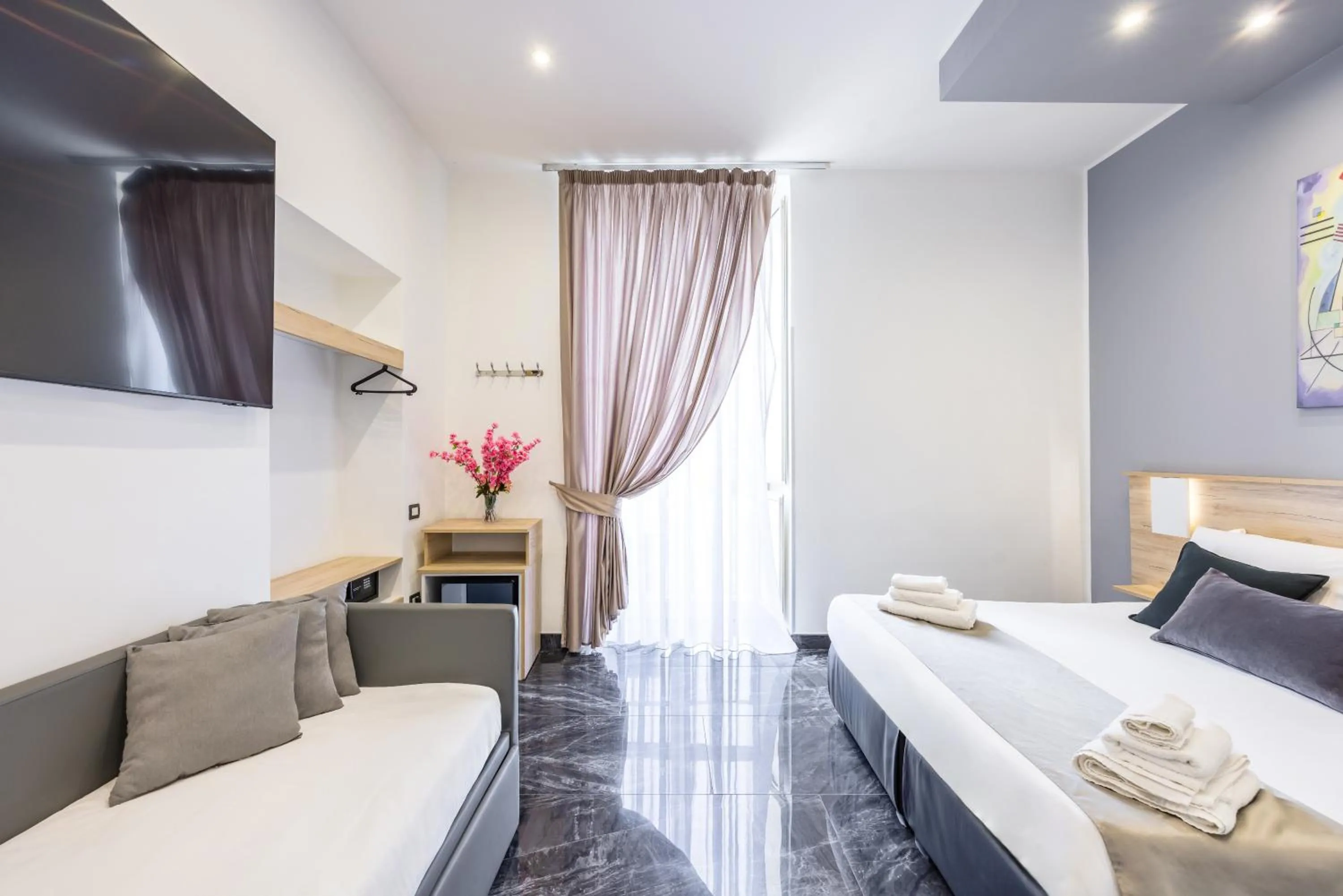 Bed in Bella Napoli Suites