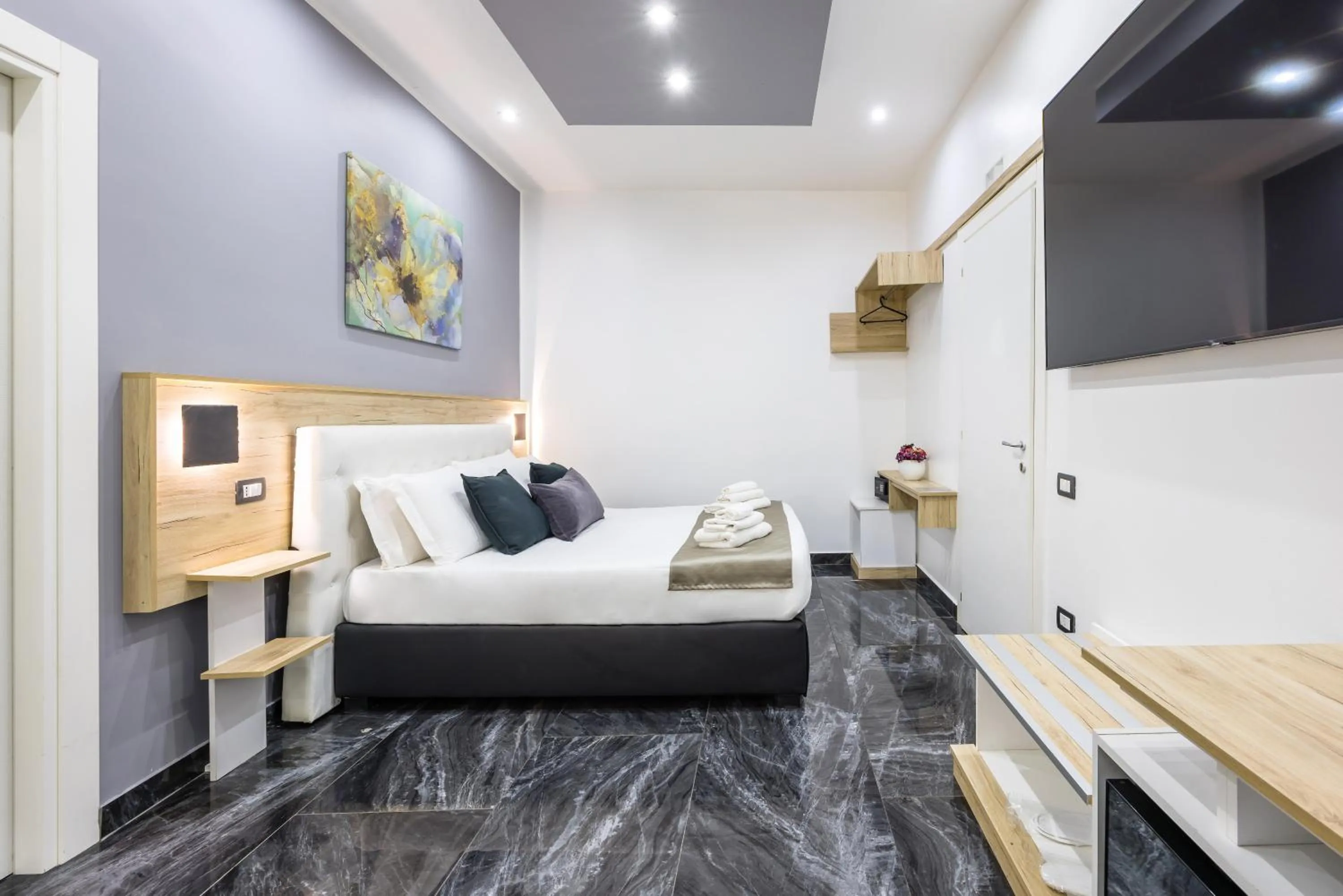 Bed in Bella Napoli Suites