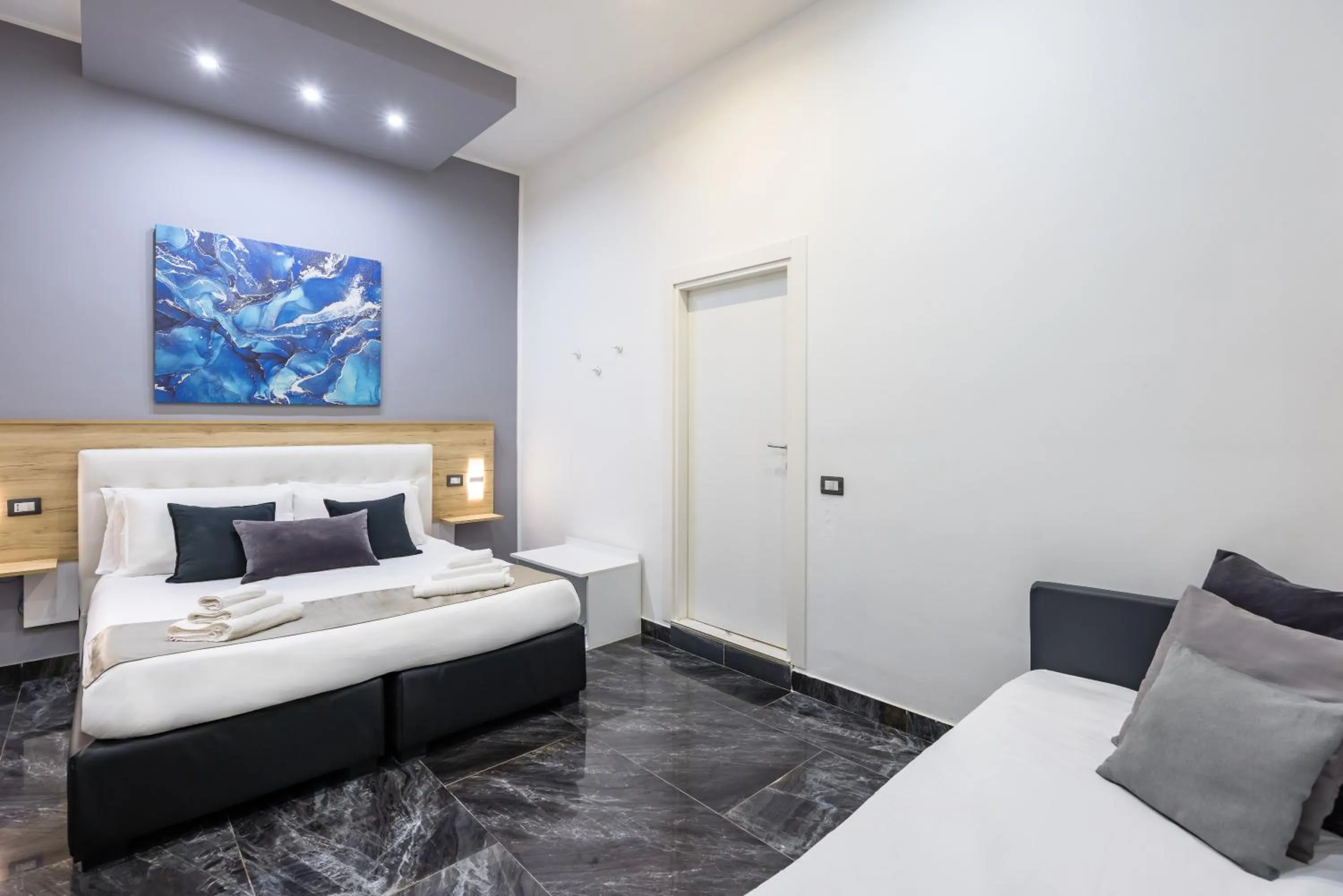 Bed in Bella Napoli Suites