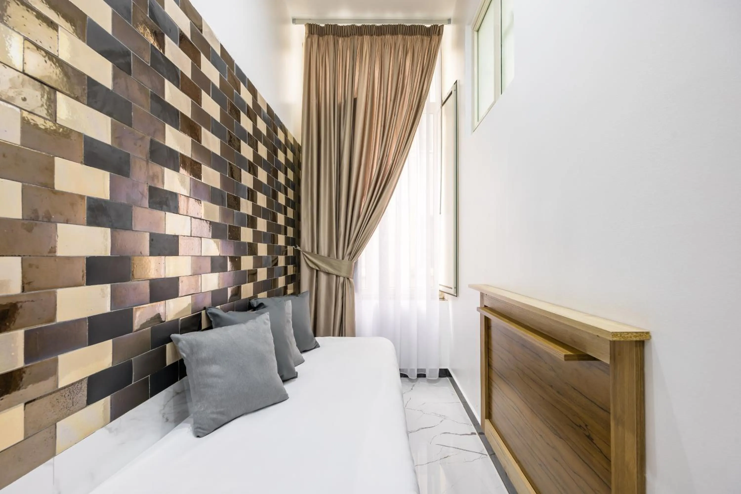 Bed in Bella Napoli Suites