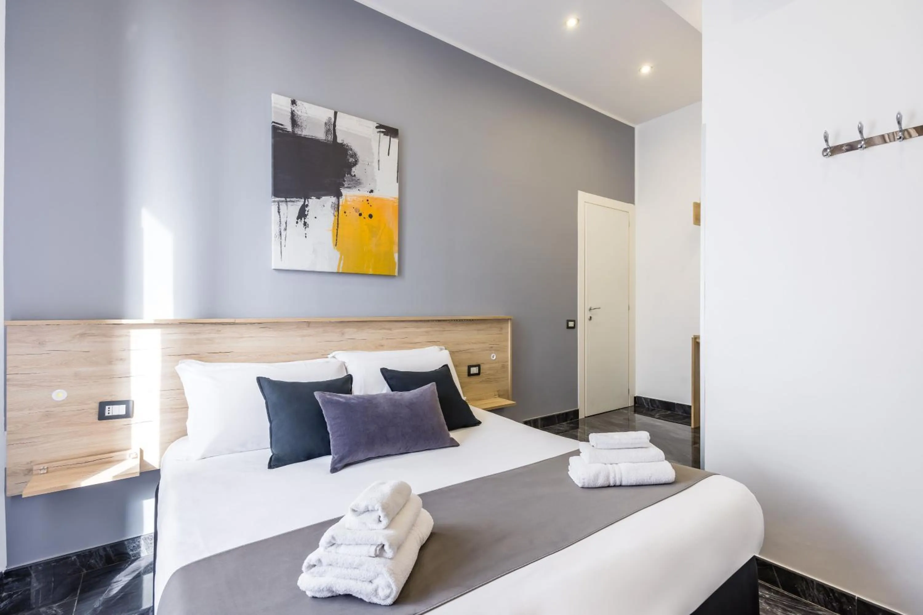 Bed in Bella Napoli Suites