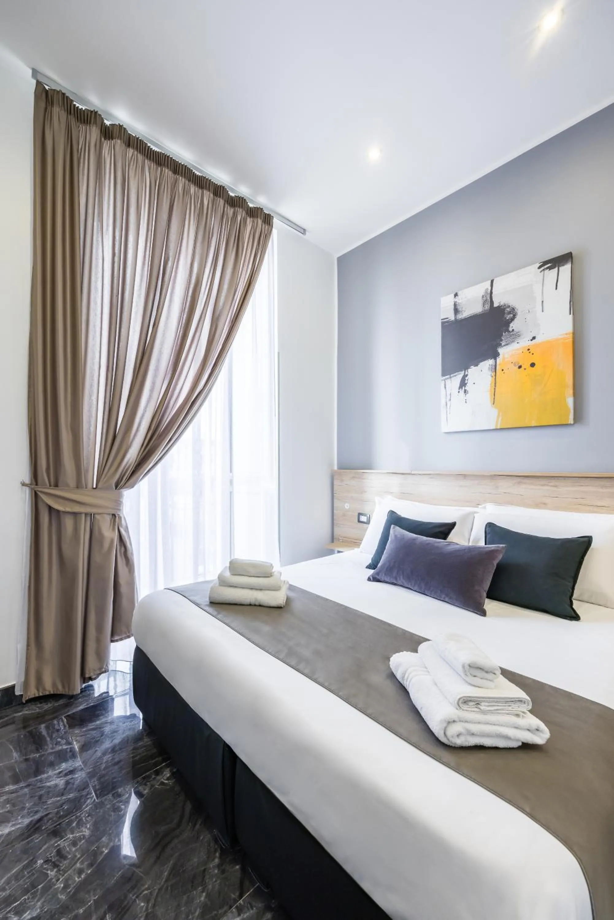 Bed in Bella Napoli Suites