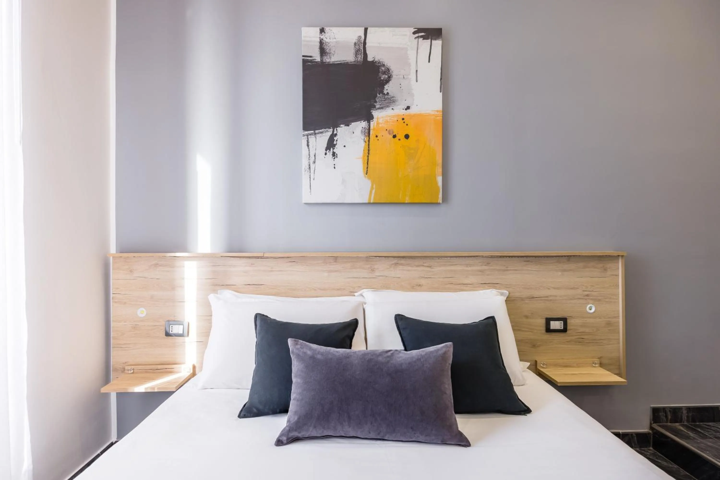 Bed in Bella Napoli Suites