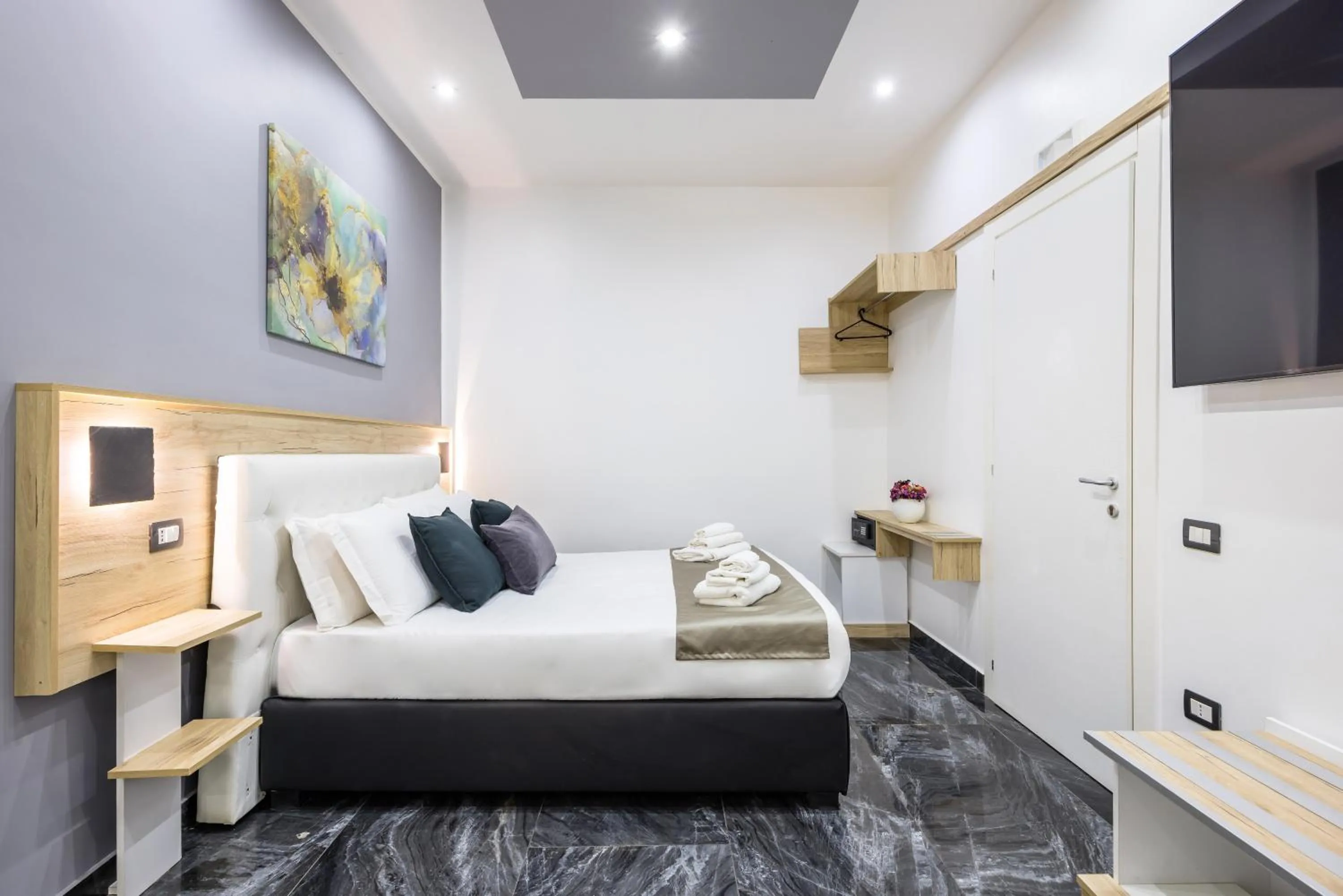 Bed in Bella Napoli Suites