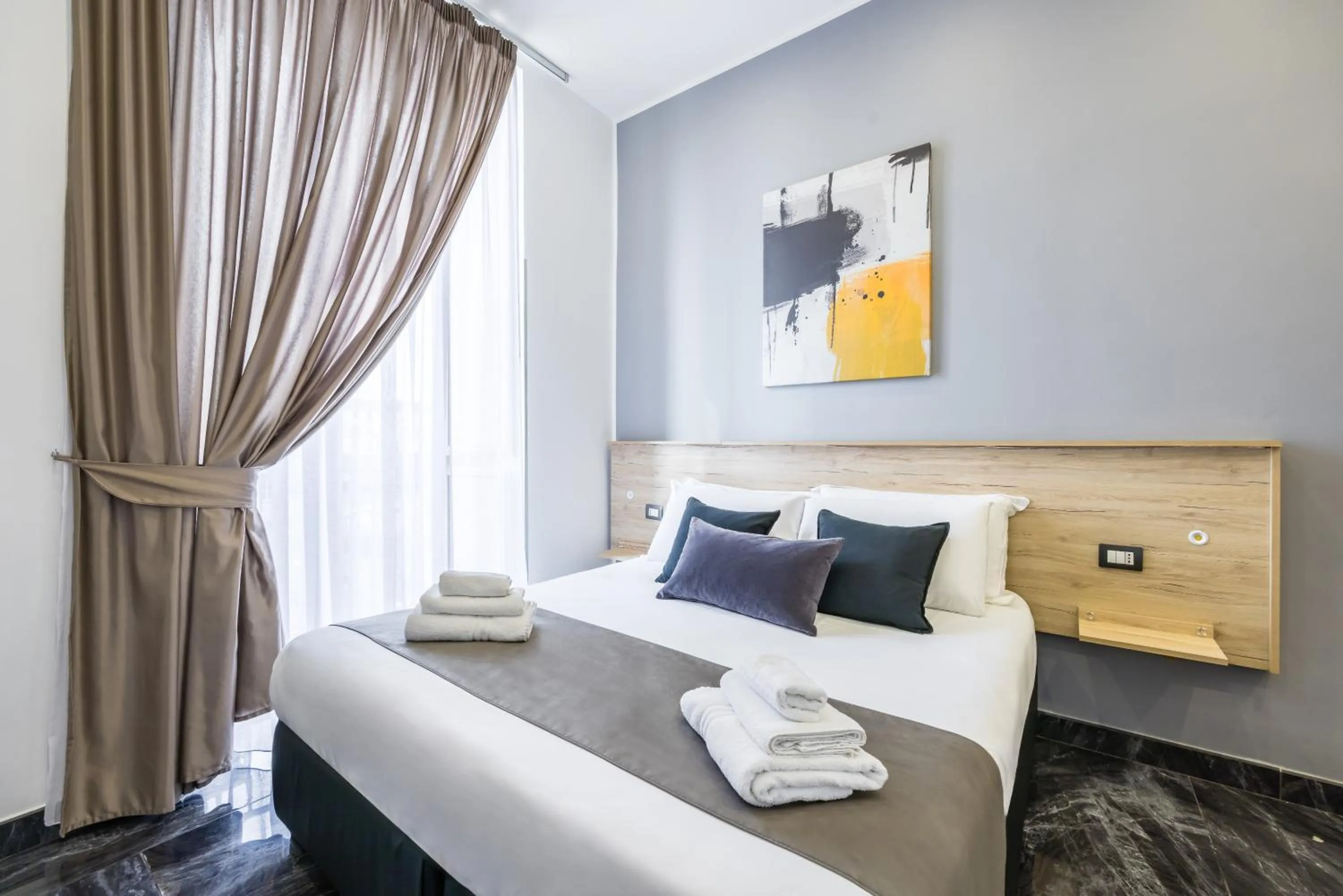 Bed in Bella Napoli Suites