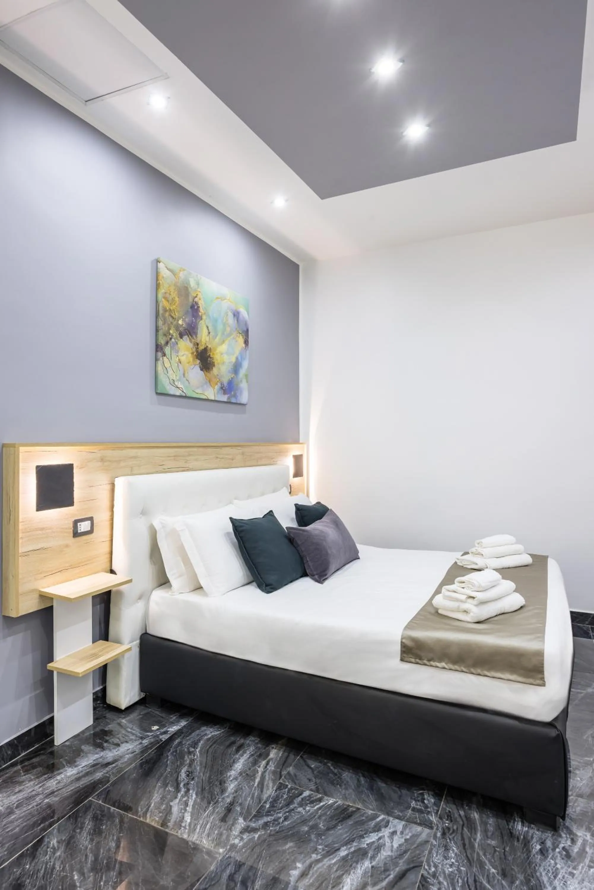 Bed in Bella Napoli Suites