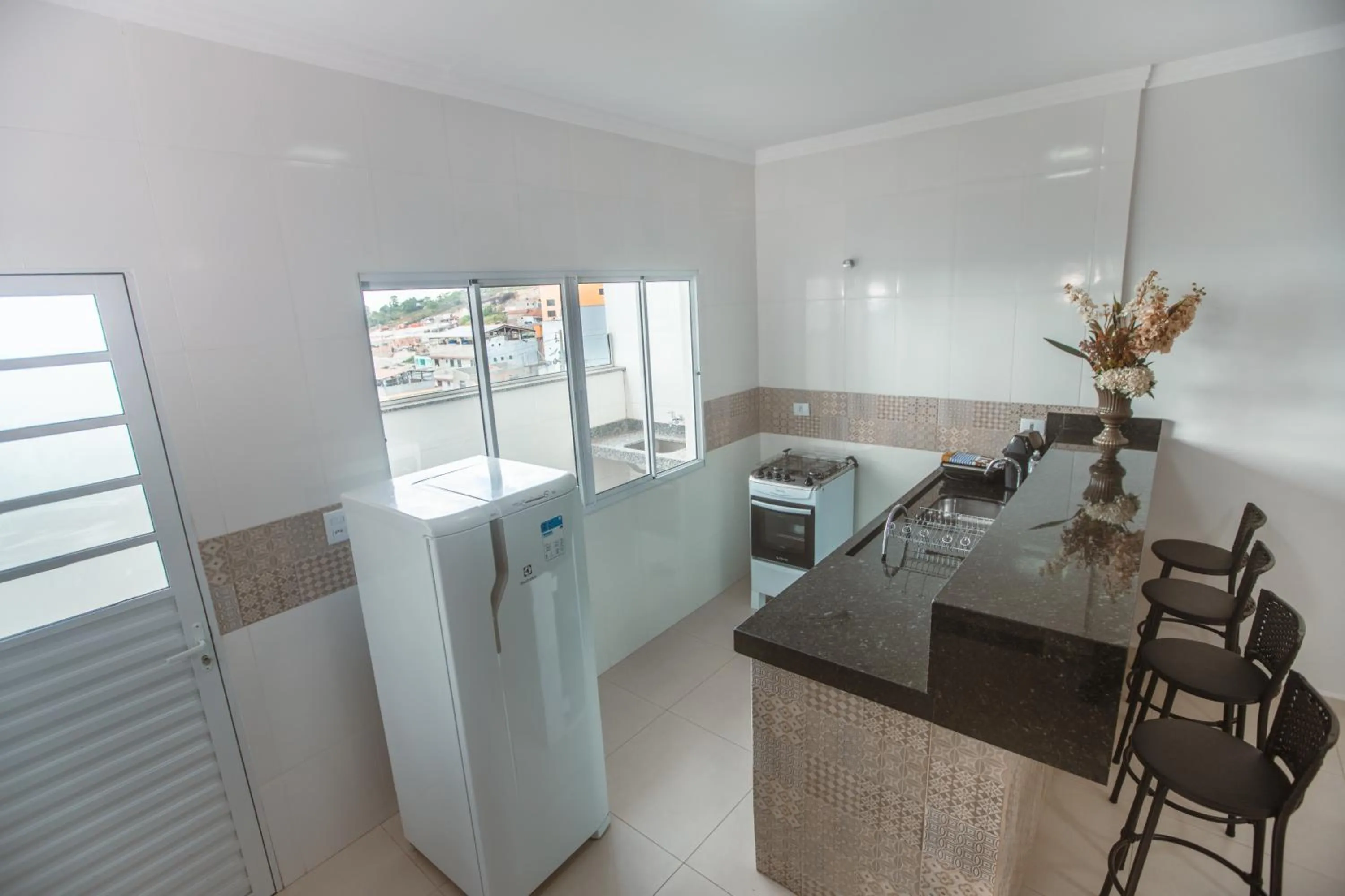 Communal kitchen in Souza Reis Apart - Unidade 1