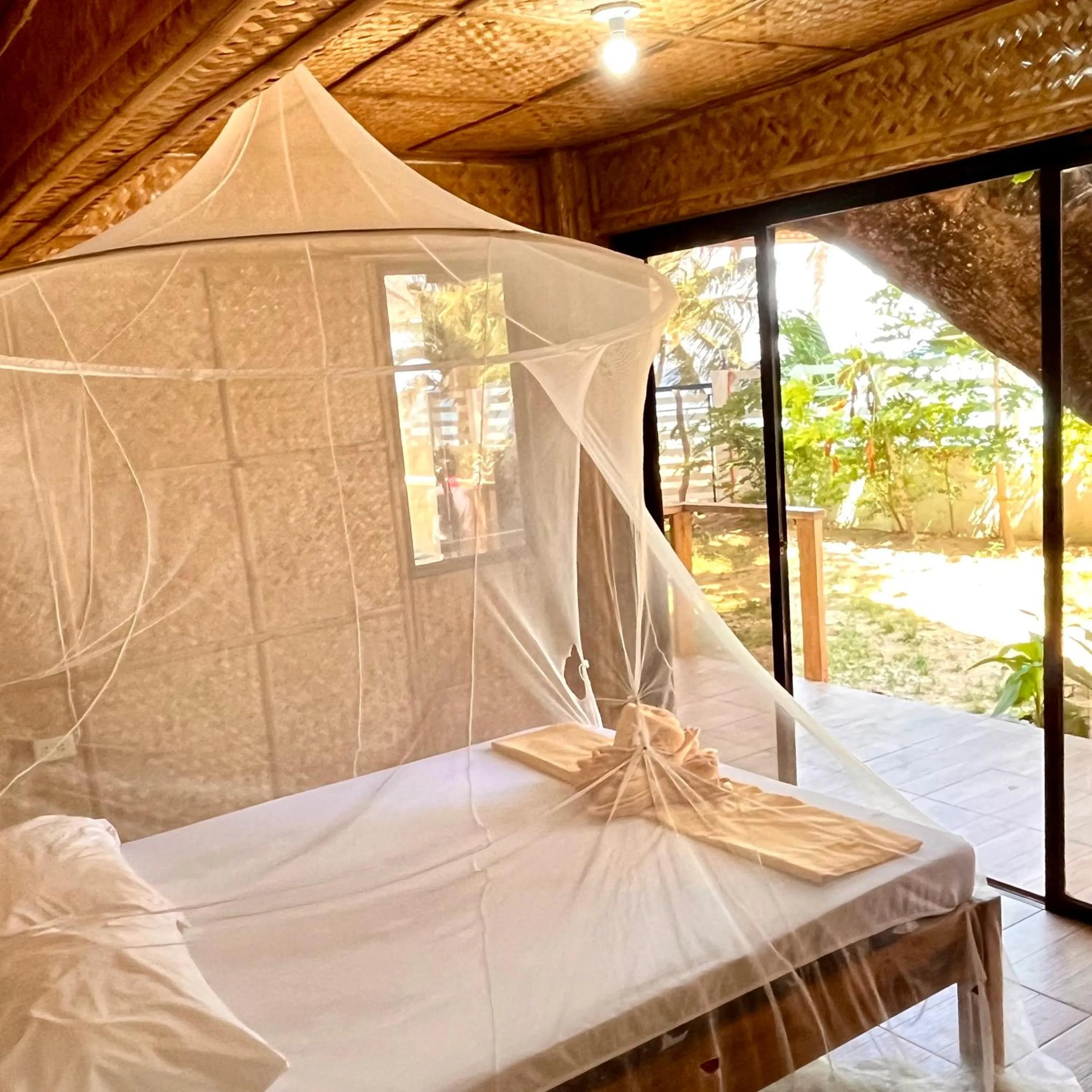 Bed in Amami Beachfront Villa with Private Beach