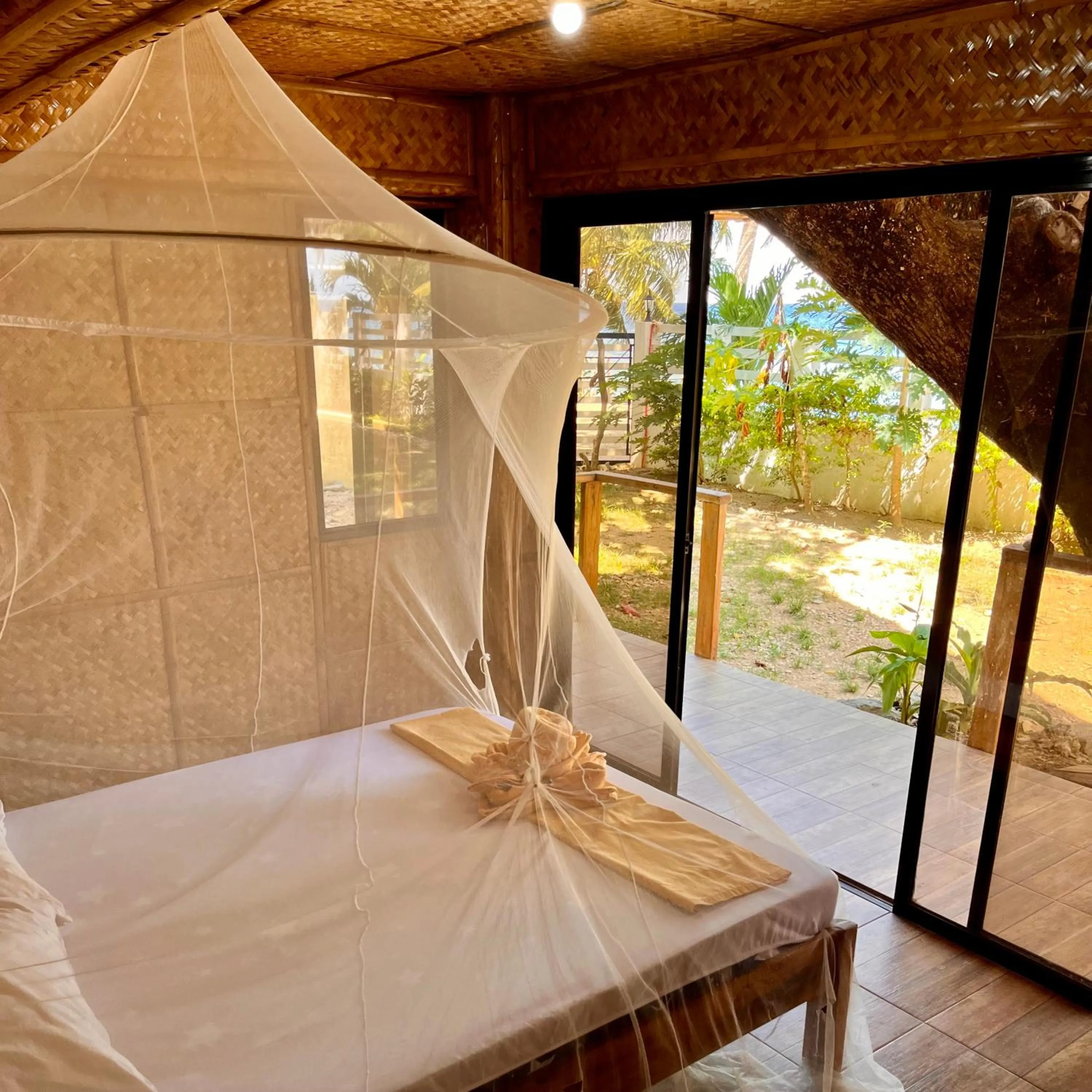 Bed in Amami Beachfront Villa with Private Beach