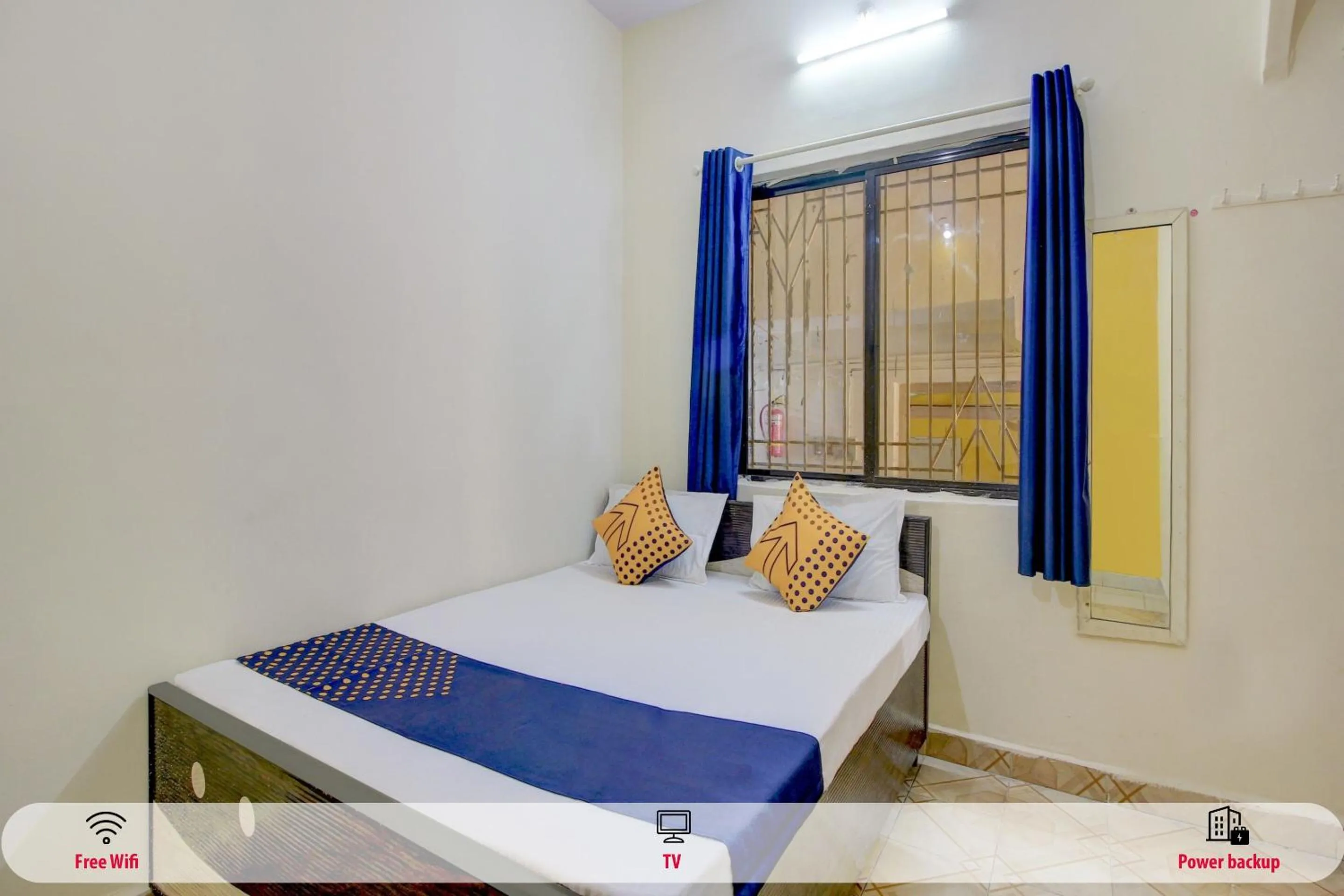 Bedroom in SPOT ON 63695 Hotel Sai Muskaan