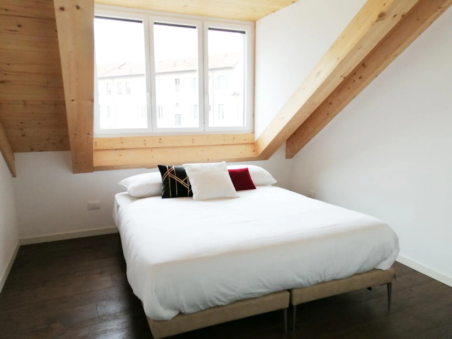 Bed in JOIVY Boutique Apartments Farneti