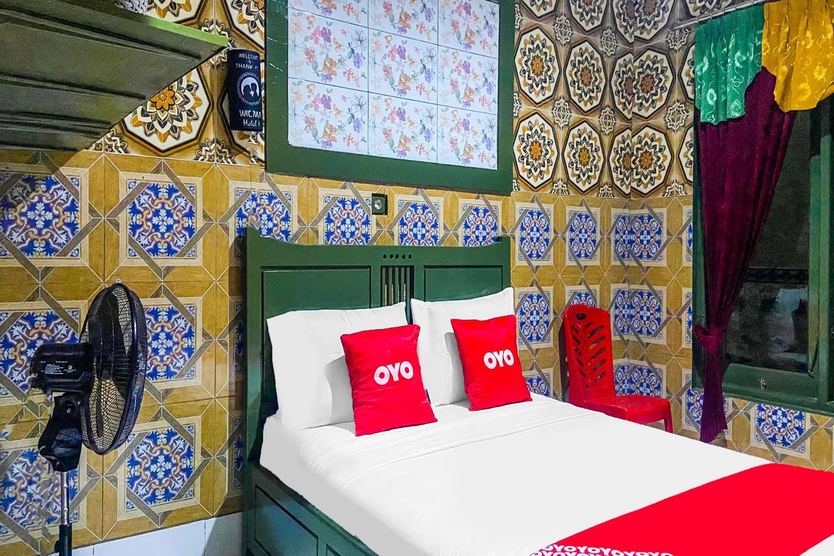 Bedroom in OYO 2518 Wilma Hotel Ii Premier