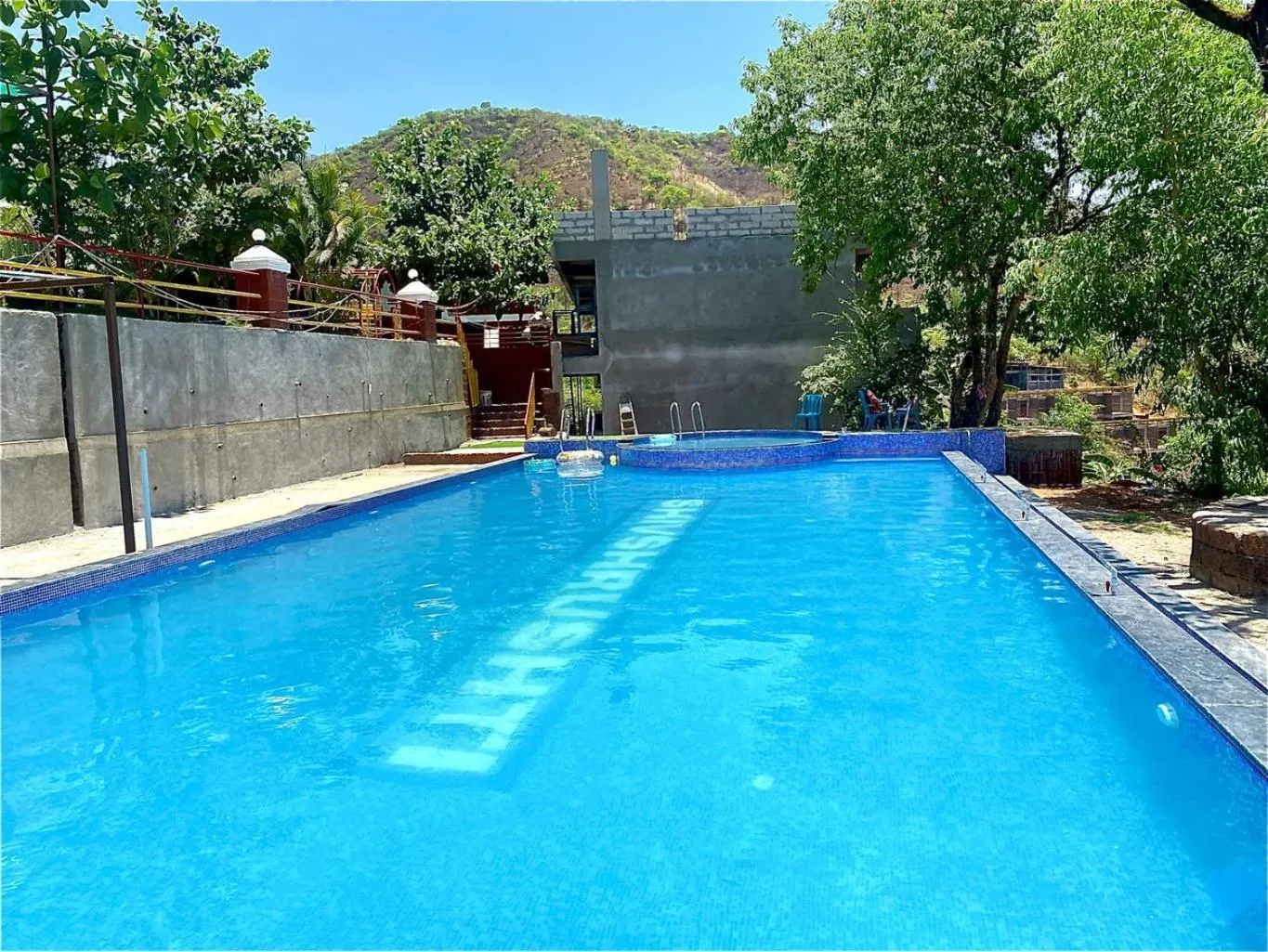 Swimming pool in Shivshrushti Agro Tourism & River Camp Tapola