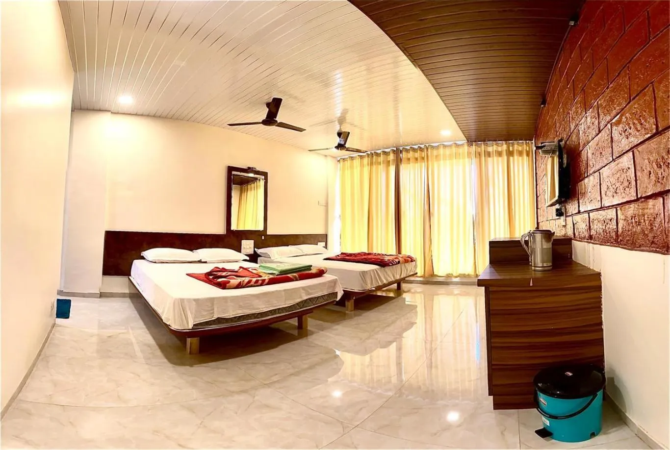 Bed in Shivshrushti Agro Tourism & River Camp Tapola