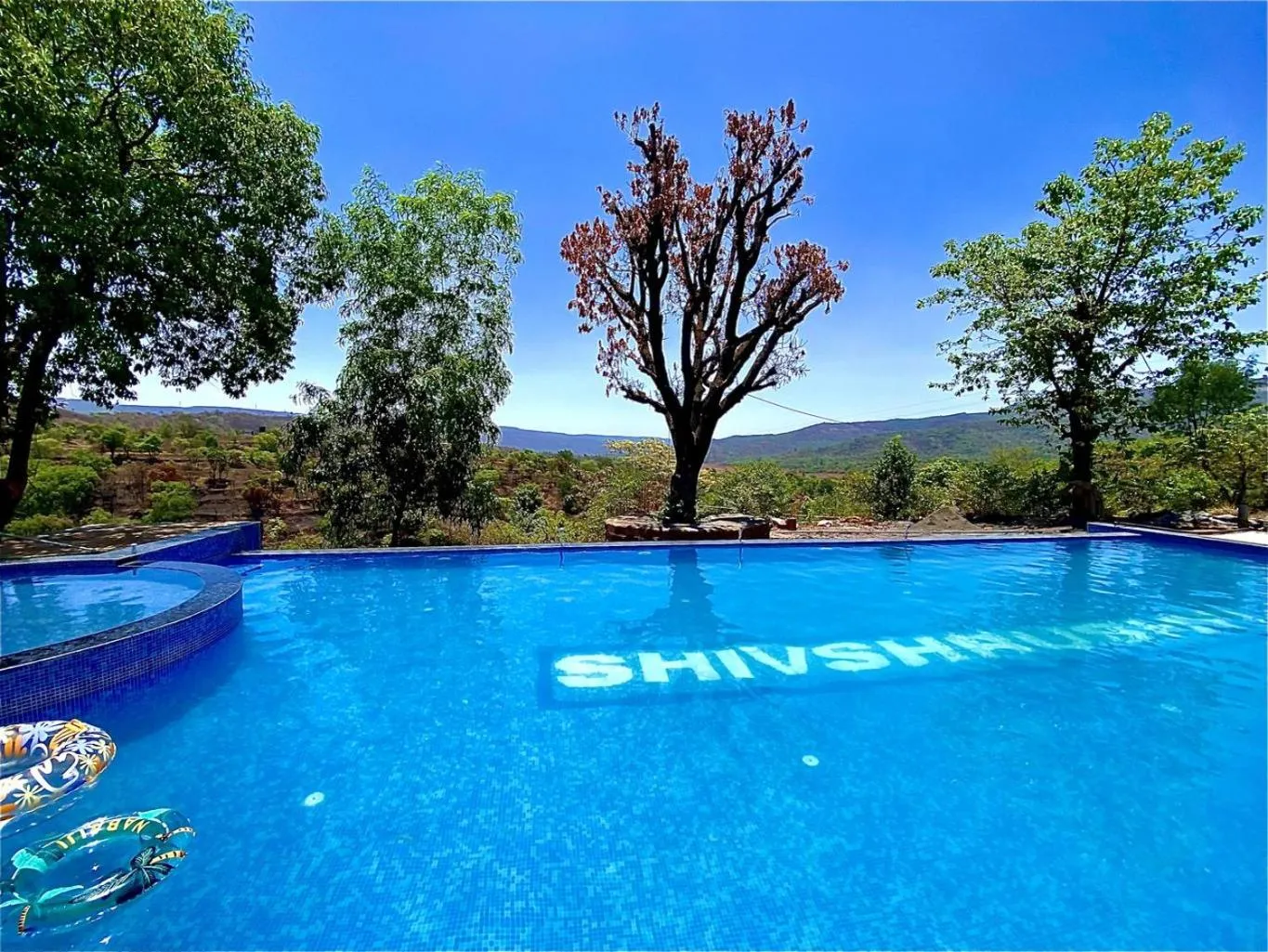 Swimming pool in Shivshrushti Agro Tourism & River Camp Tapola