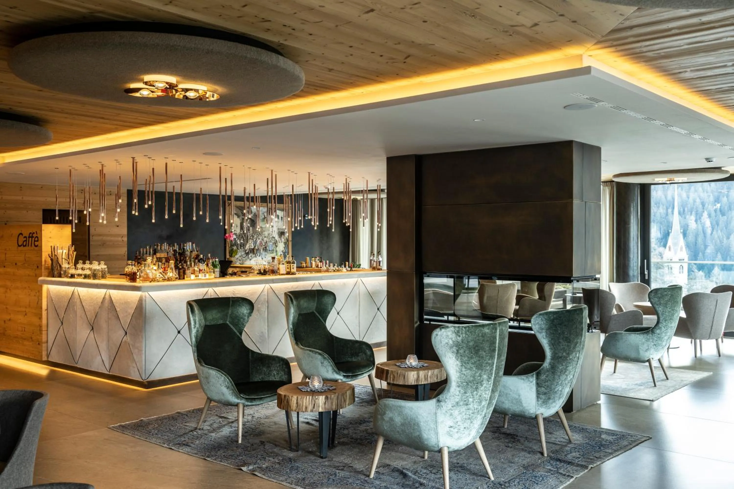 Lounge or bar in Ciampedie Luxury Alpine Spa Hotel