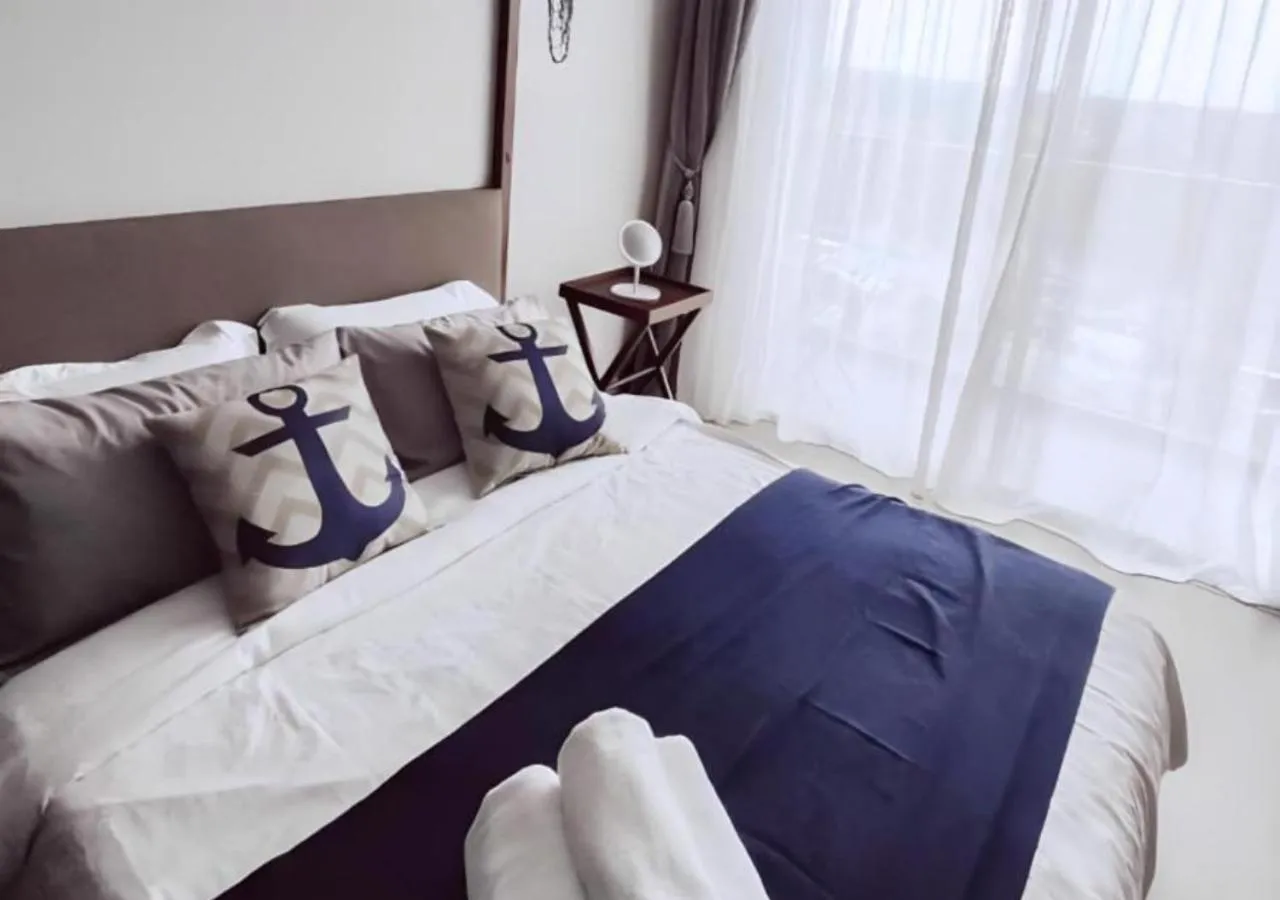 Bed in Timurbay Seafront Residence & Suites