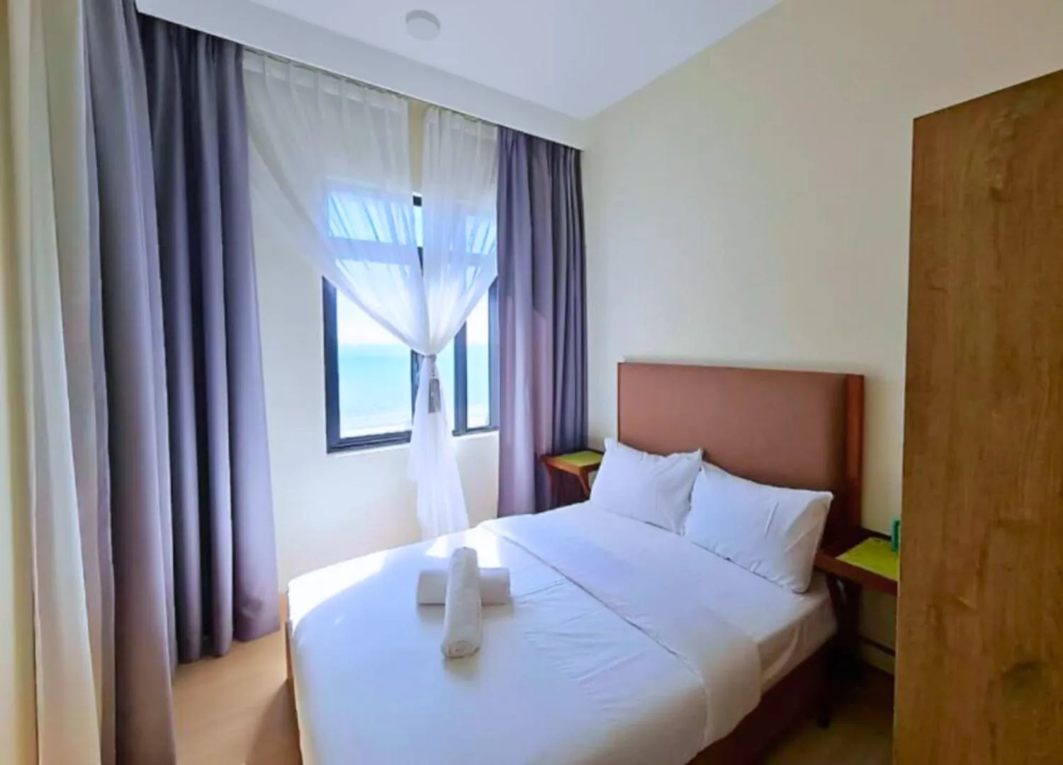 Bed in Timurbay Seafront Residence & Suites