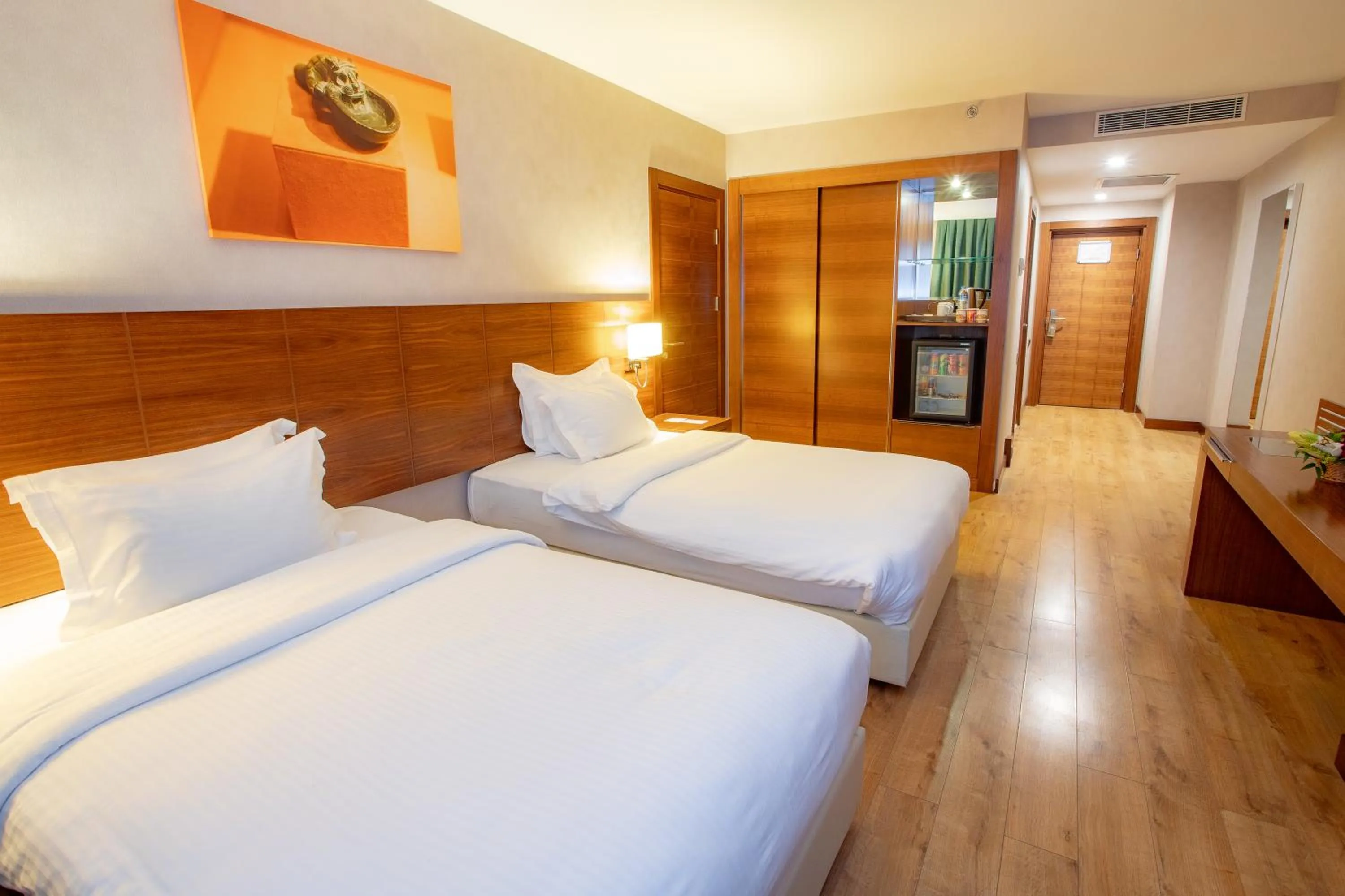 Communal lounge/ TV room, Bed in Nevali Hotel & Convention Center