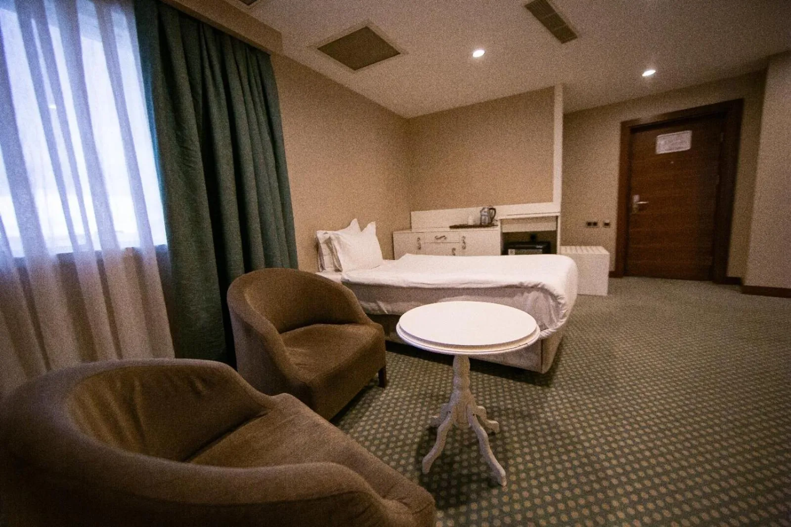 Bed in Nevali Hotel & Convention Center