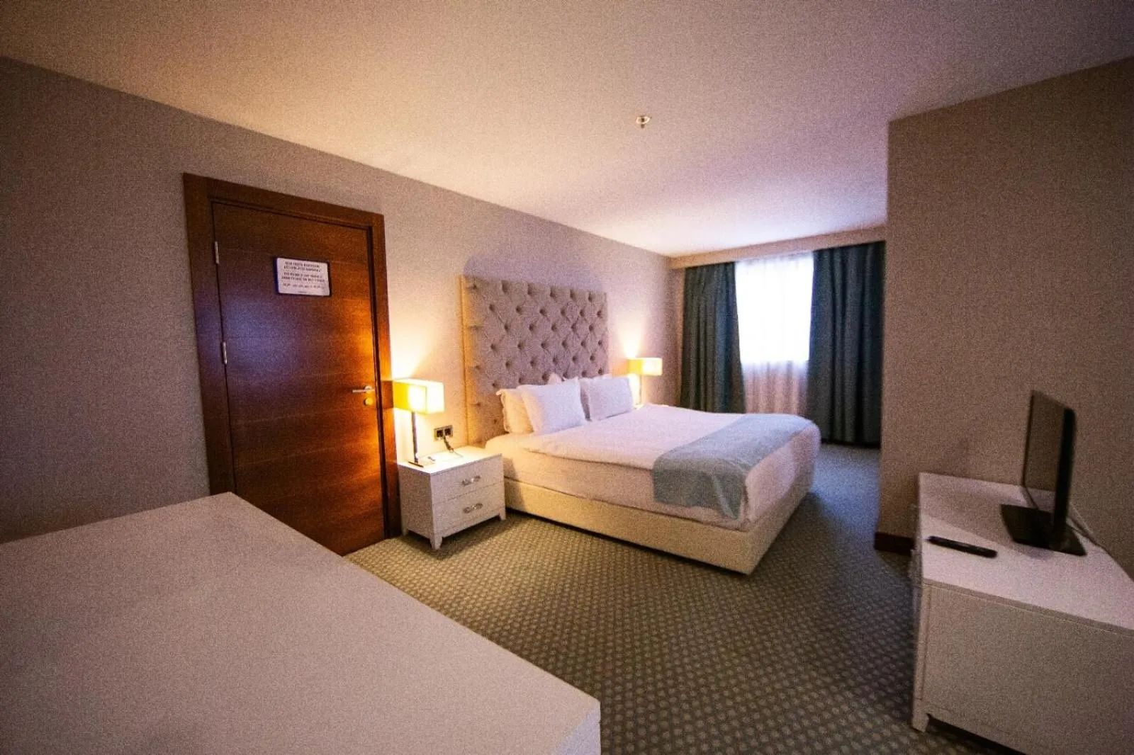 Bed in Nevali Hotel & Convention Center