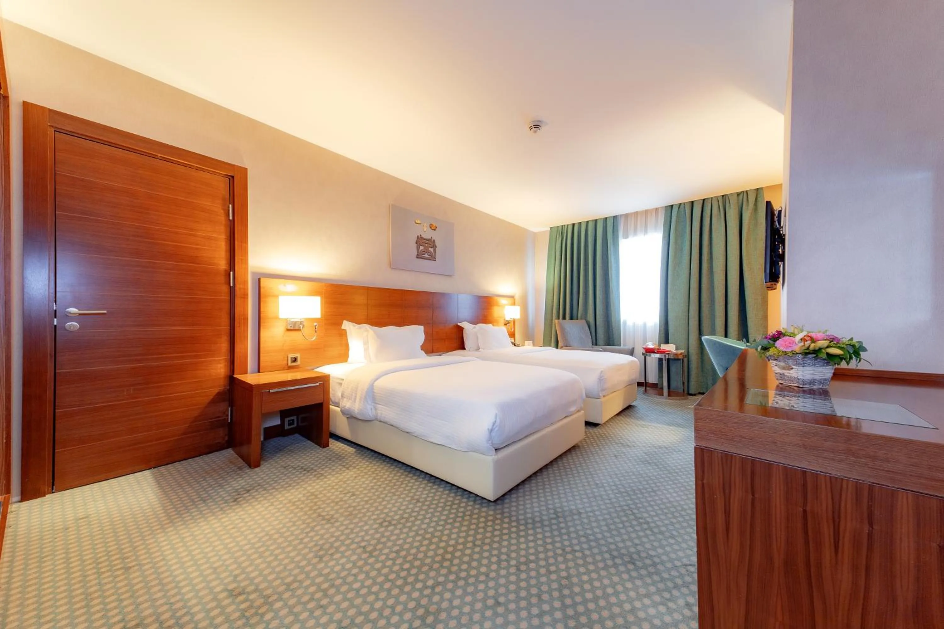 Communal lounge/ TV room, Bed in Nevali Hotel & Convention Center