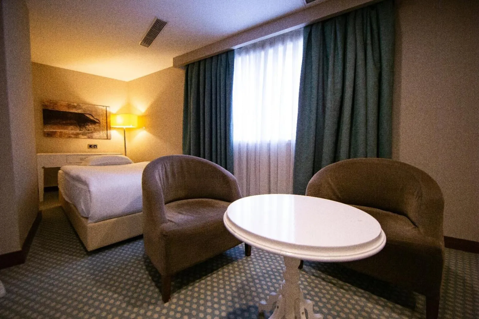 Bed in Nevali Hotel & Convention Center