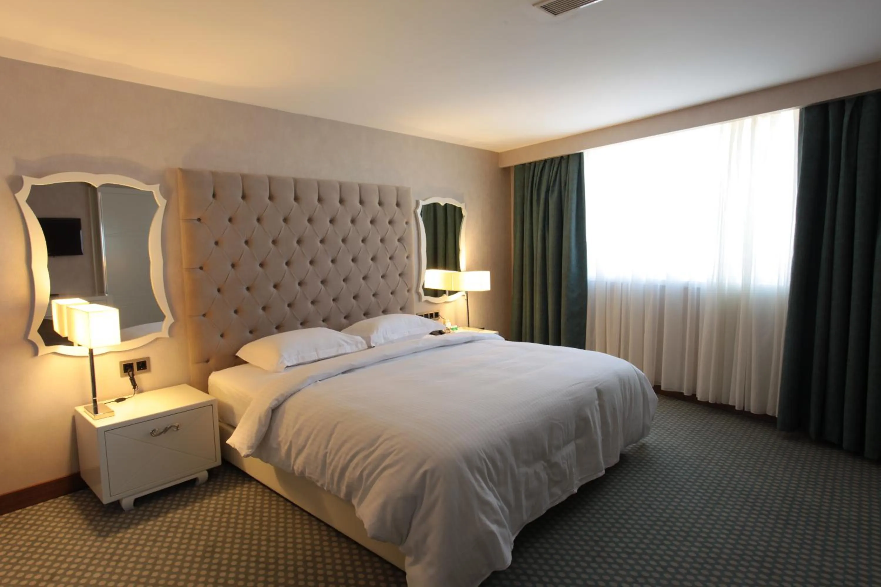 Bed in Nevali Hotel & Convention Center