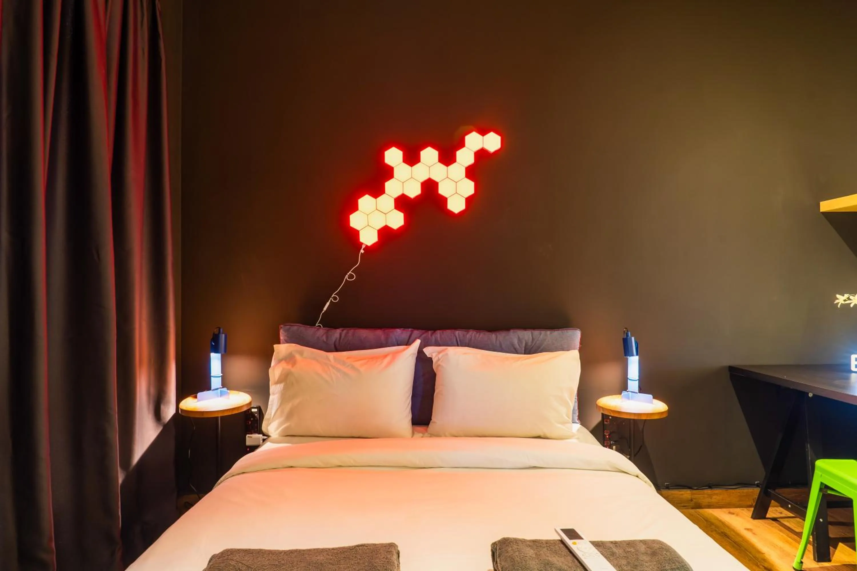 Bed in Manhattan Theme Suite by Nest Home at Austin Heights