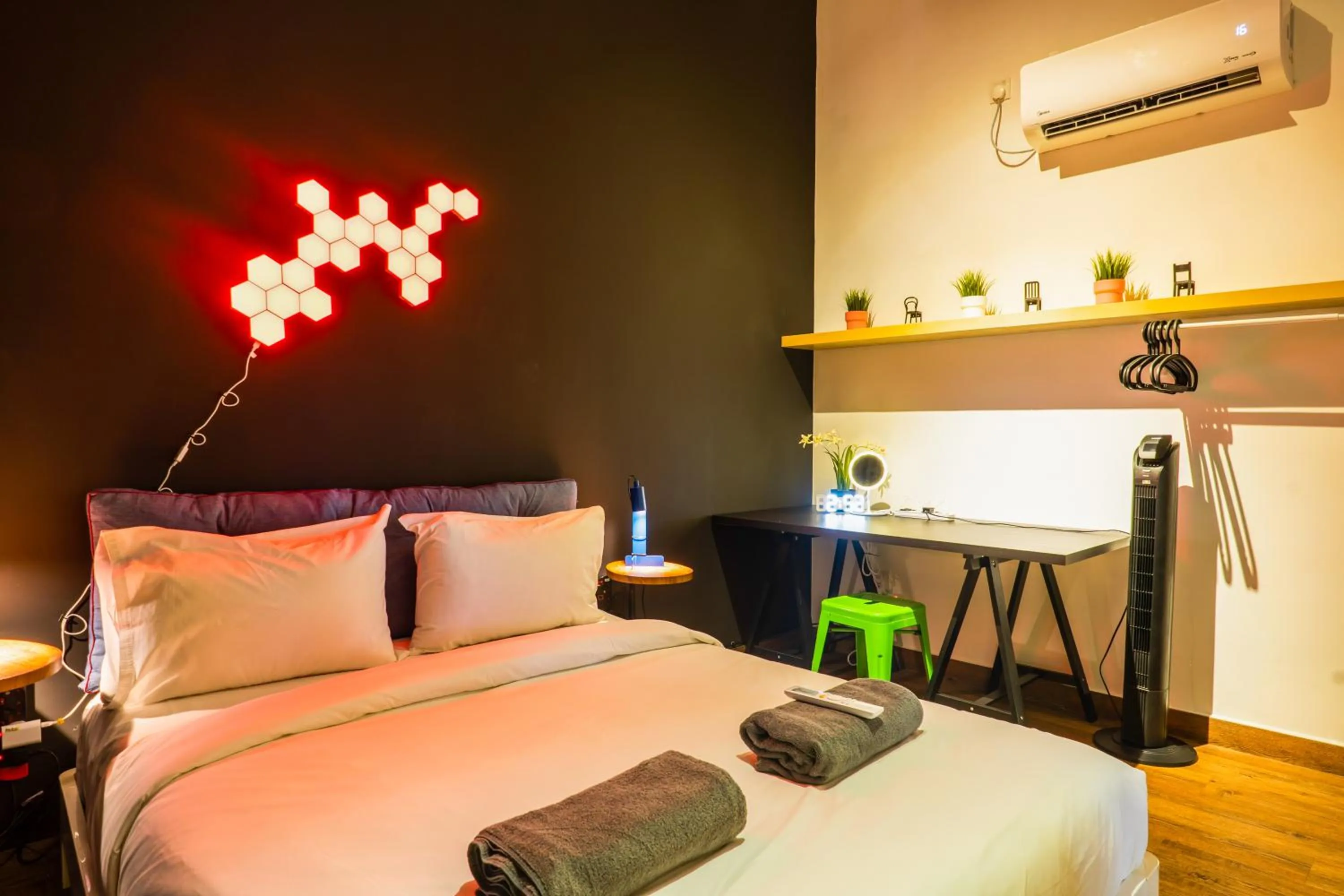 Bed in Manhattan Theme Suite by Nest Home at Austin Heights