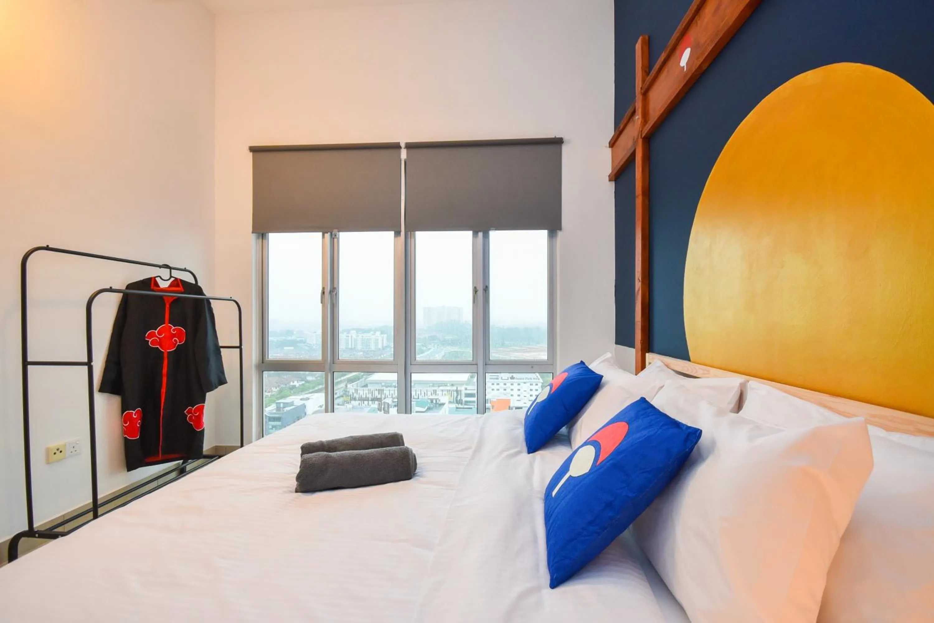 Bed in Manhattan Theme Suite by Nest Home at Austin Heights