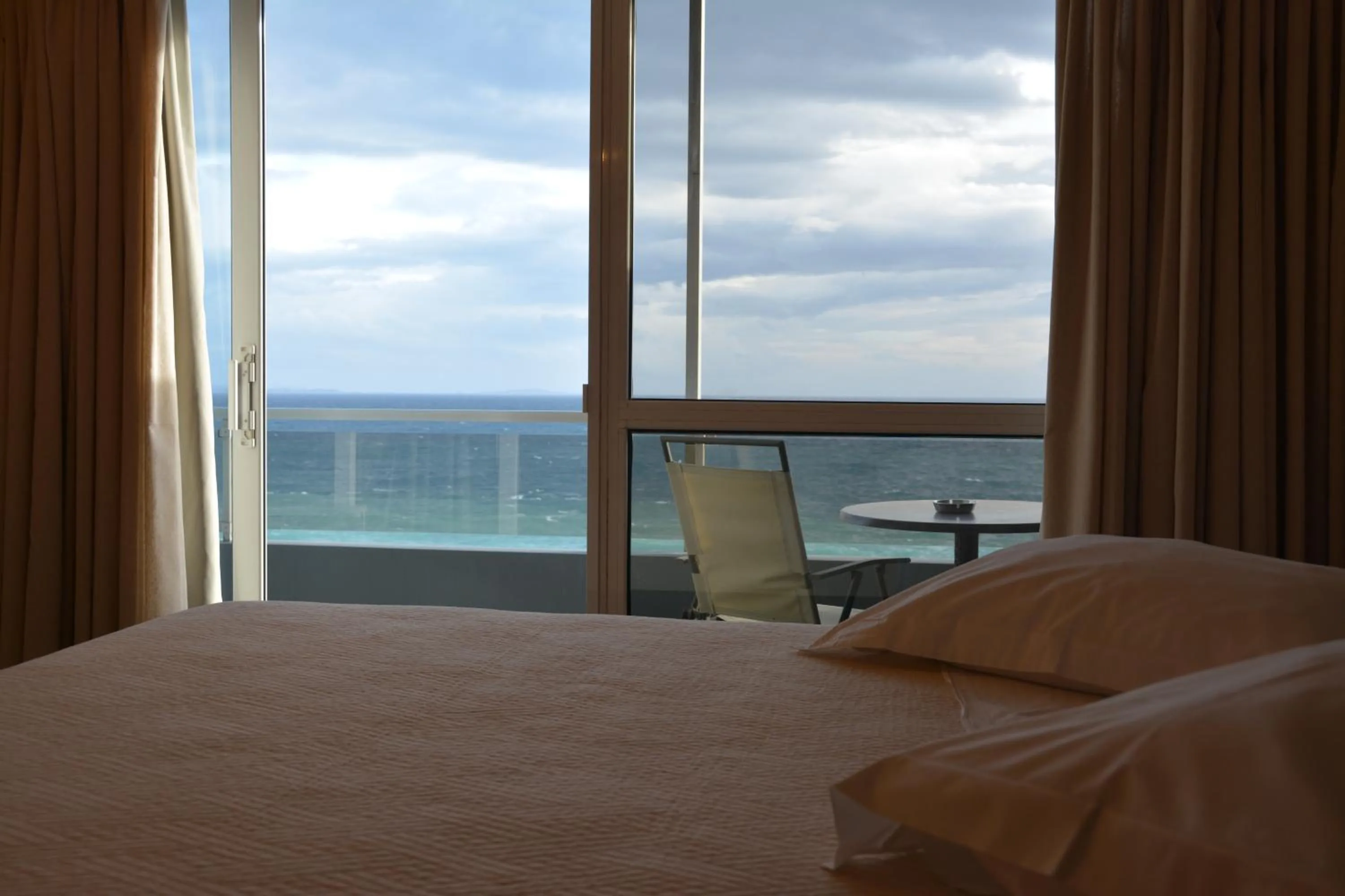 Bed in Scorpios Sea Side Hotel