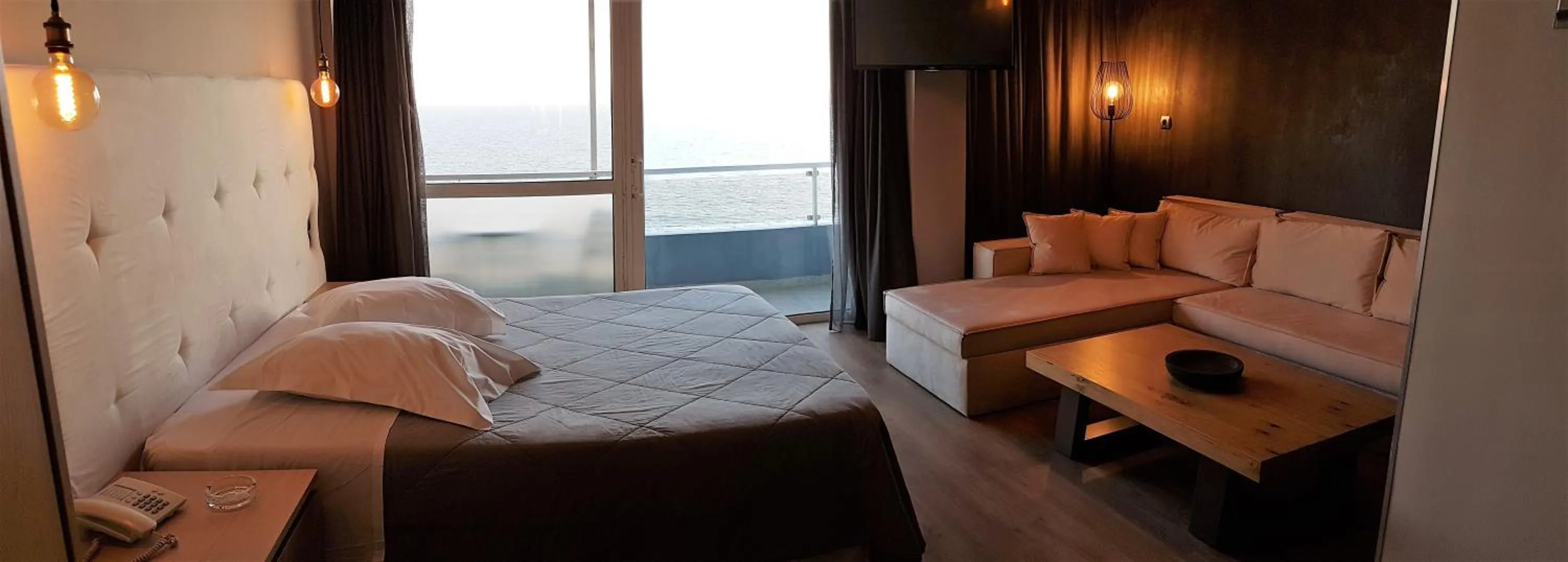 Bed in Scorpios Sea Side Hotel