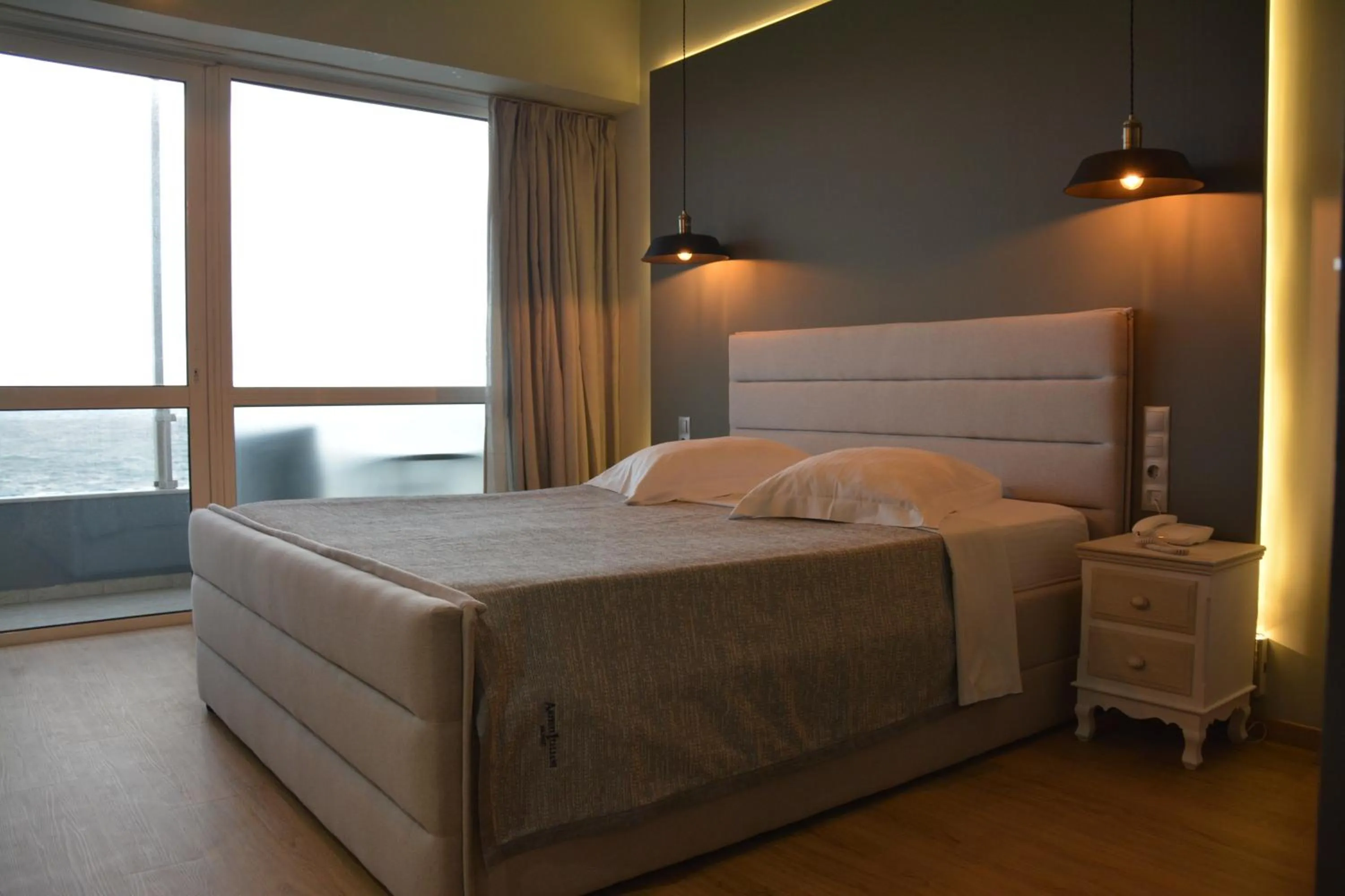 Bed in Scorpios Sea Side Hotel