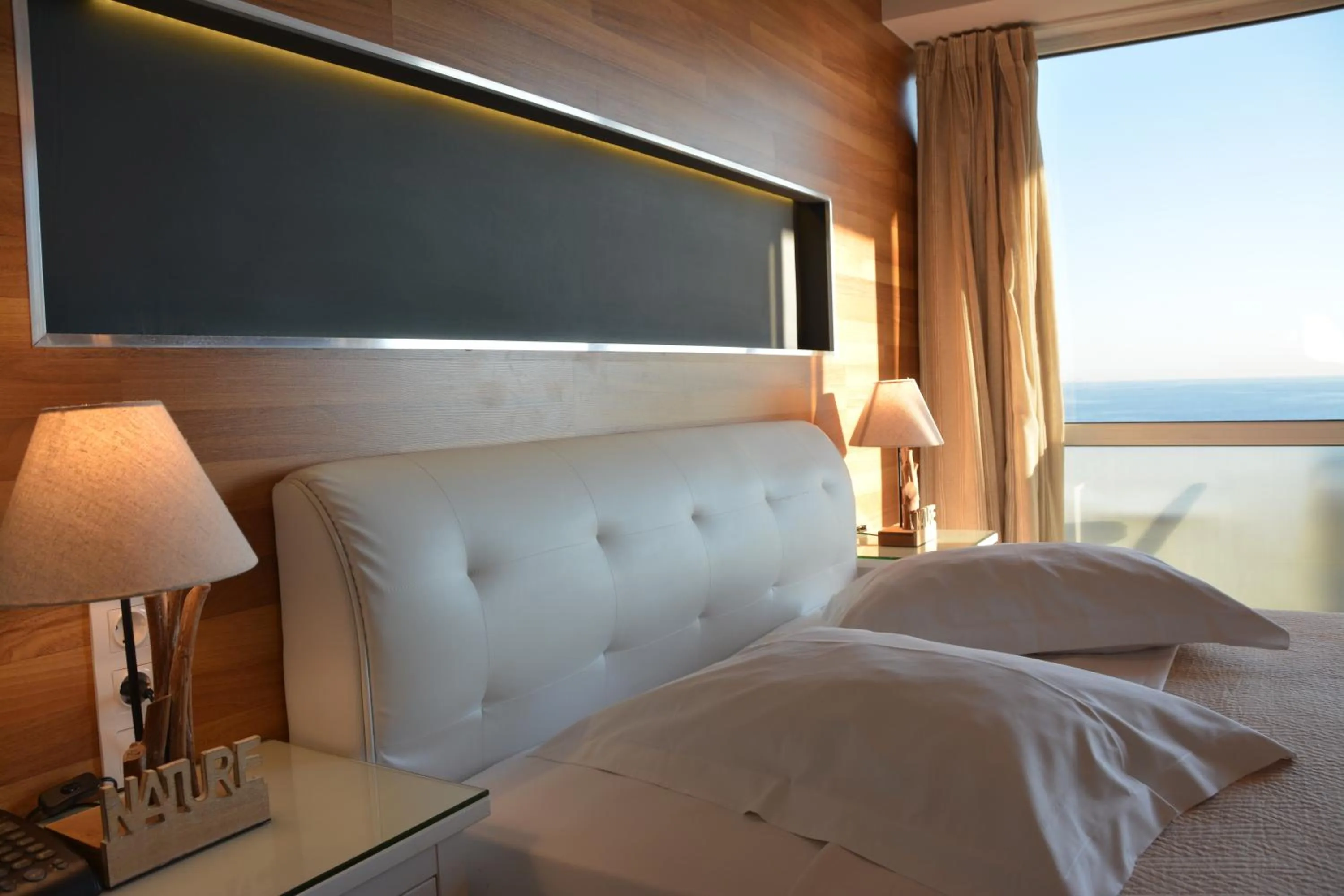 Bed in Scorpios Sea Side Hotel