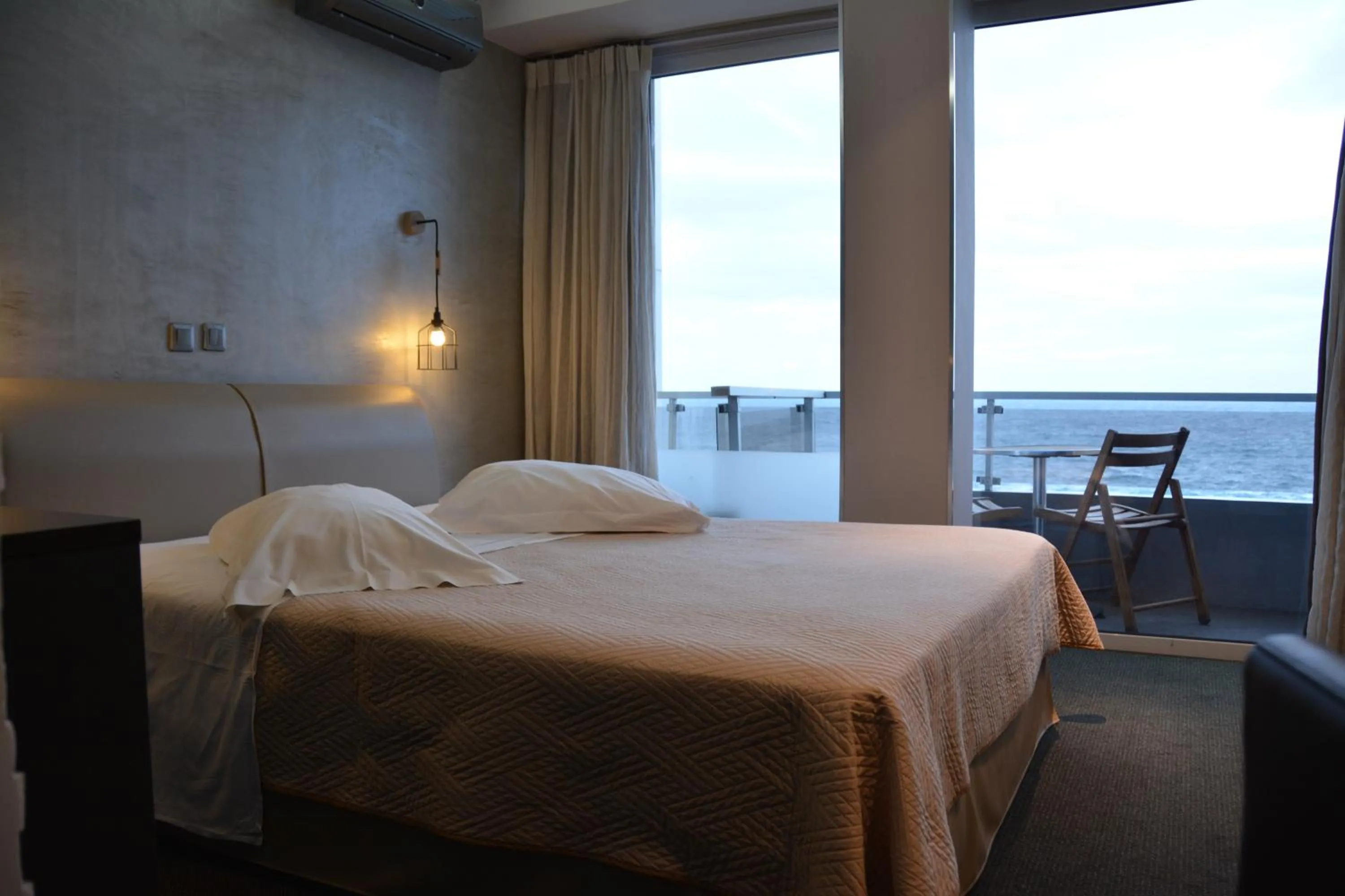 Bed in Scorpios Sea Side Hotel