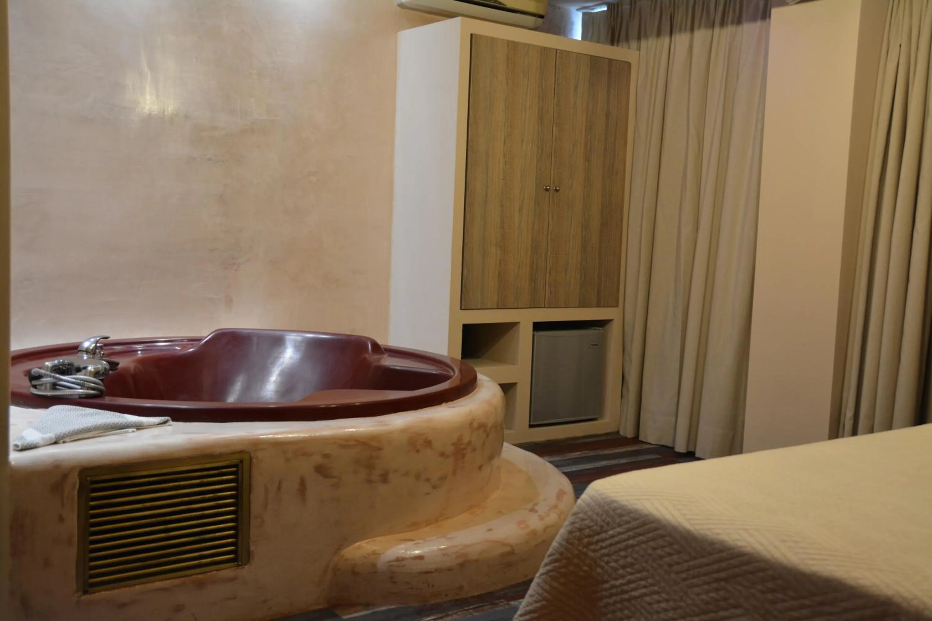 Bed in Scorpios Sea Side Hotel