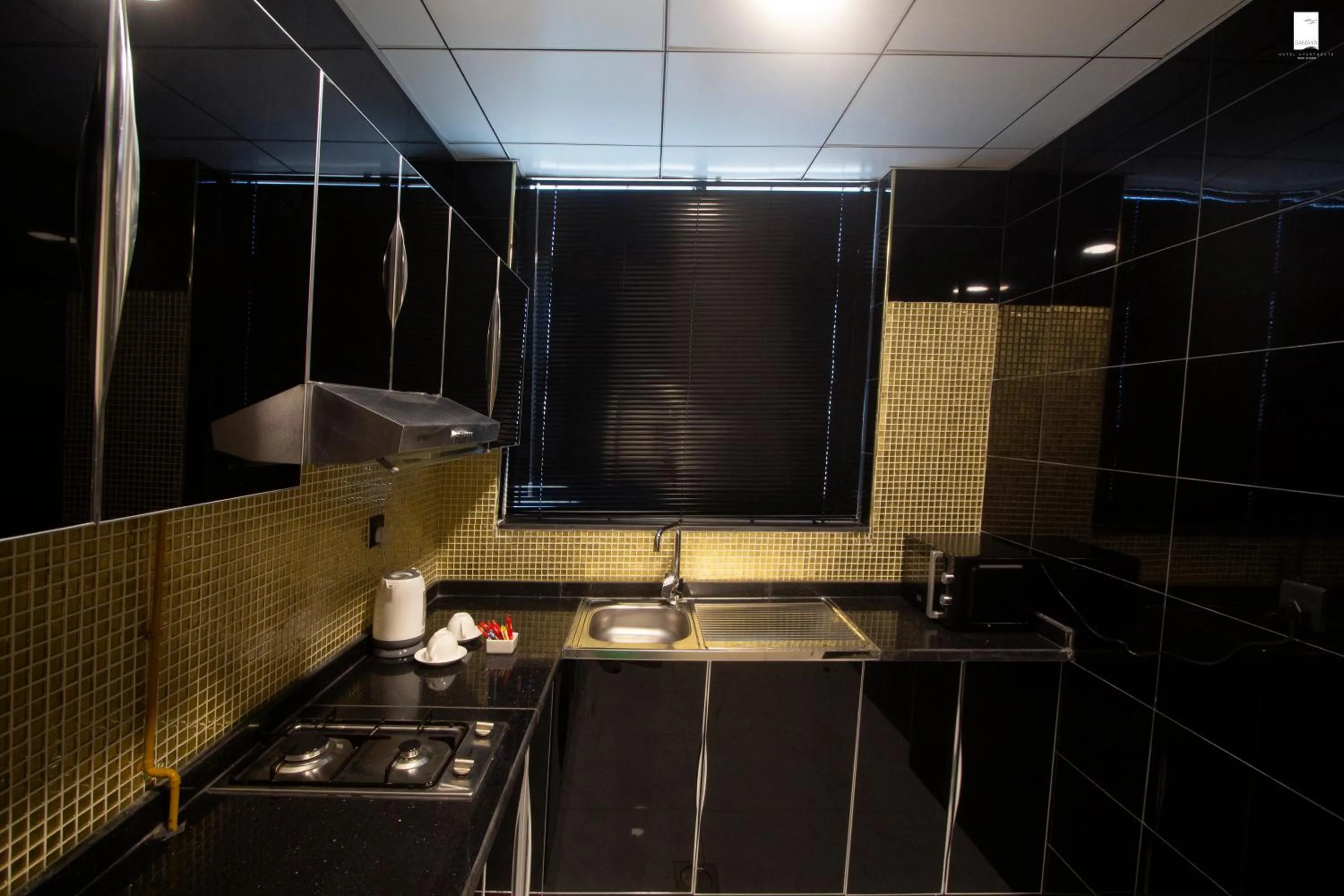 Kitchen or kitchenette in Samaya Hotel Apartment Dubai
