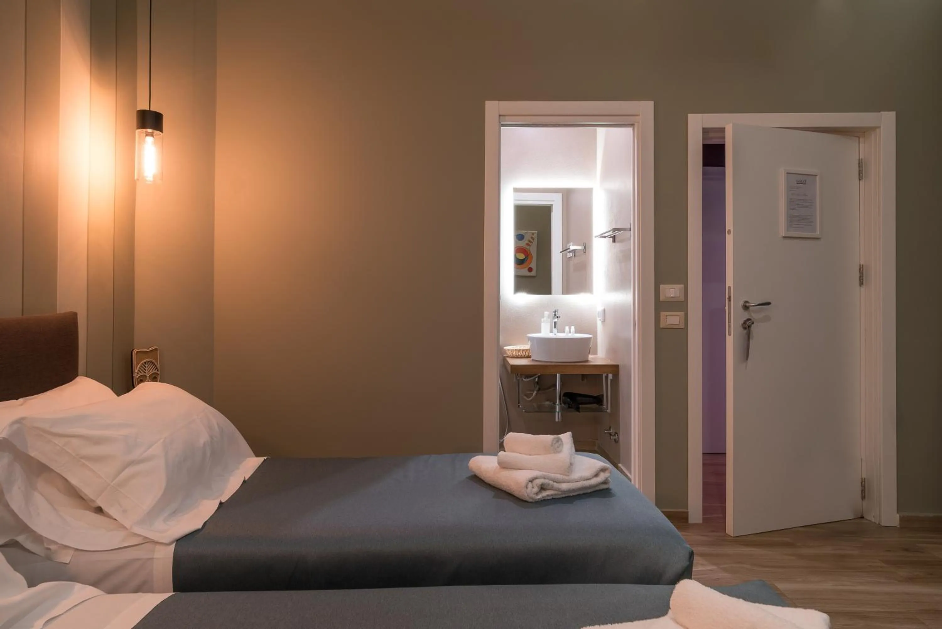 Bed in GOGO` Petit Hotel